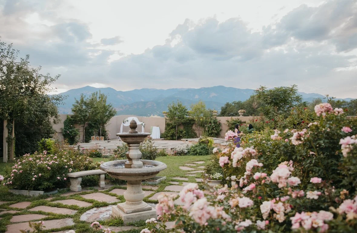 Rose garden with water fountain and mountain backdrop at Hillside gardens