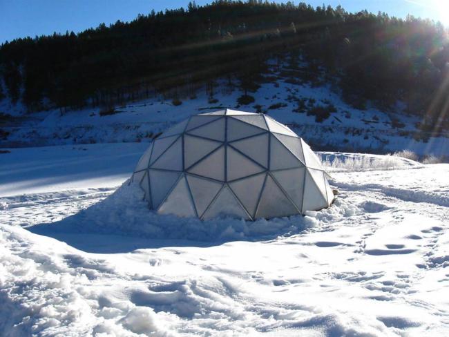 geodesic dome greenhouse in the snow