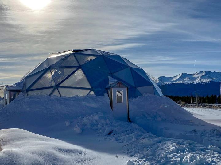 Growing Dome greenhouse with snow piled up