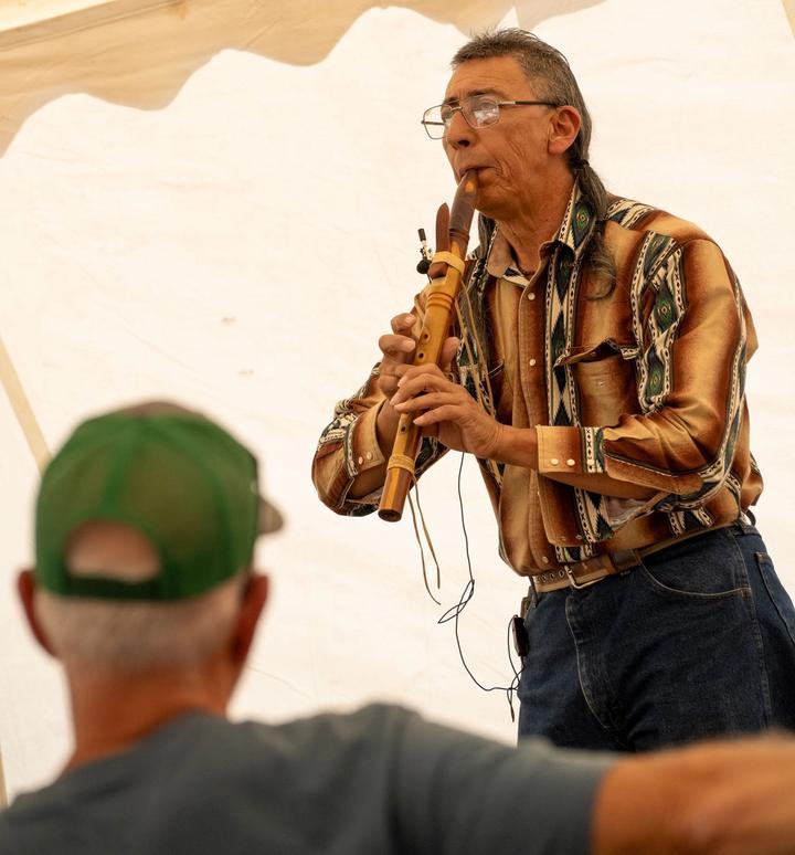 Native American flute player performing at the Customer Appreciation Event