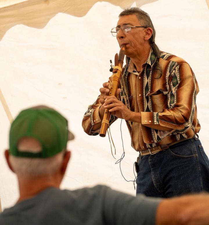 Native American flute player performing at the Customer Appreciation Event