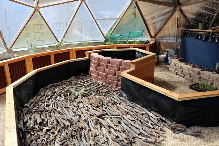 Filling raised garden beds in a Growing Dome greenhouse