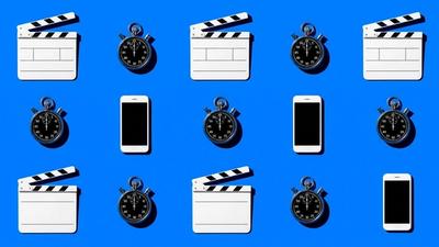 Overhead grid of video clapperboards, stopwatches, and smartphones highlighting AI video ad production.