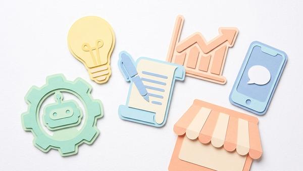 Paper cutout icons showing AI robot, lightbulb, script, growth chart, smartphone and storefront for small business marketing