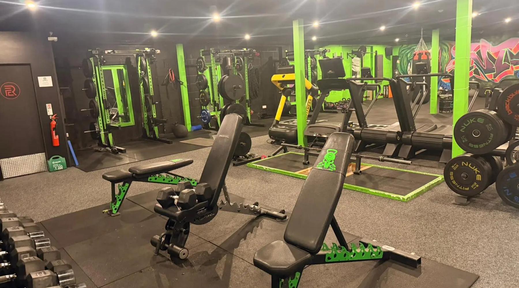 Gym day pass Kirkby Lonsdale: TNT Fitness gym floor with benches, dumbbells, squat racks and treadmills