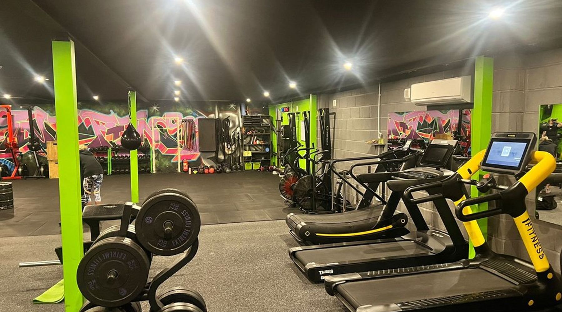 Ingleton gym option TNT Fitness: gym floor with free weights, treadmills and graffiti mural