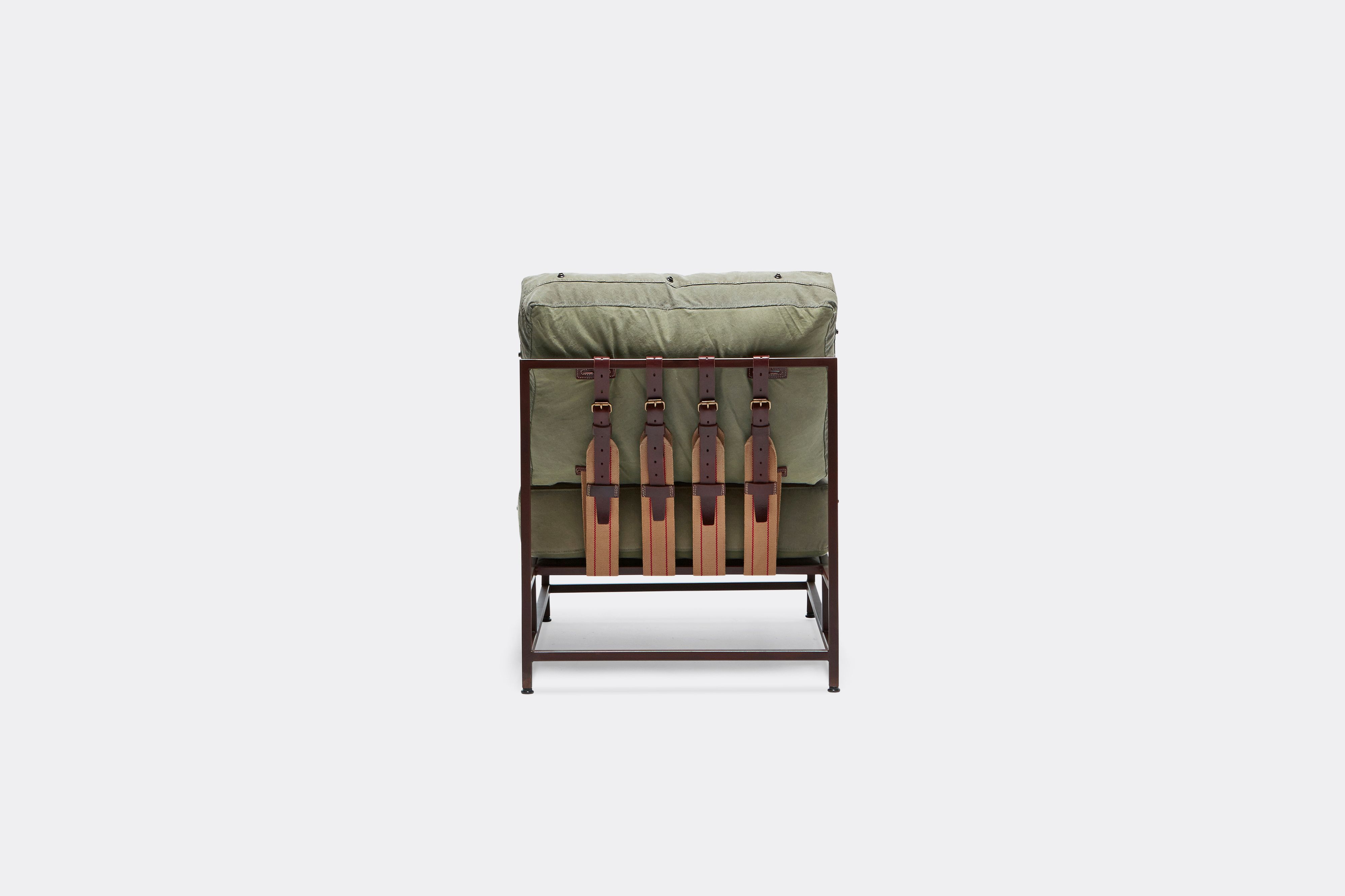back view of military canvas chair with marbled rust frame and leather belt