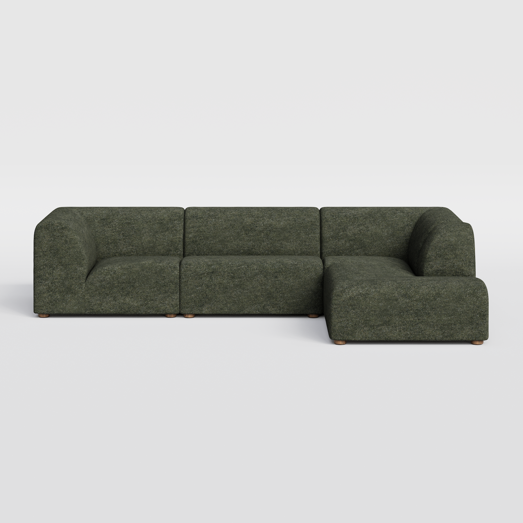 Dark green modular L-shaped sectional sofa with rounded corners.