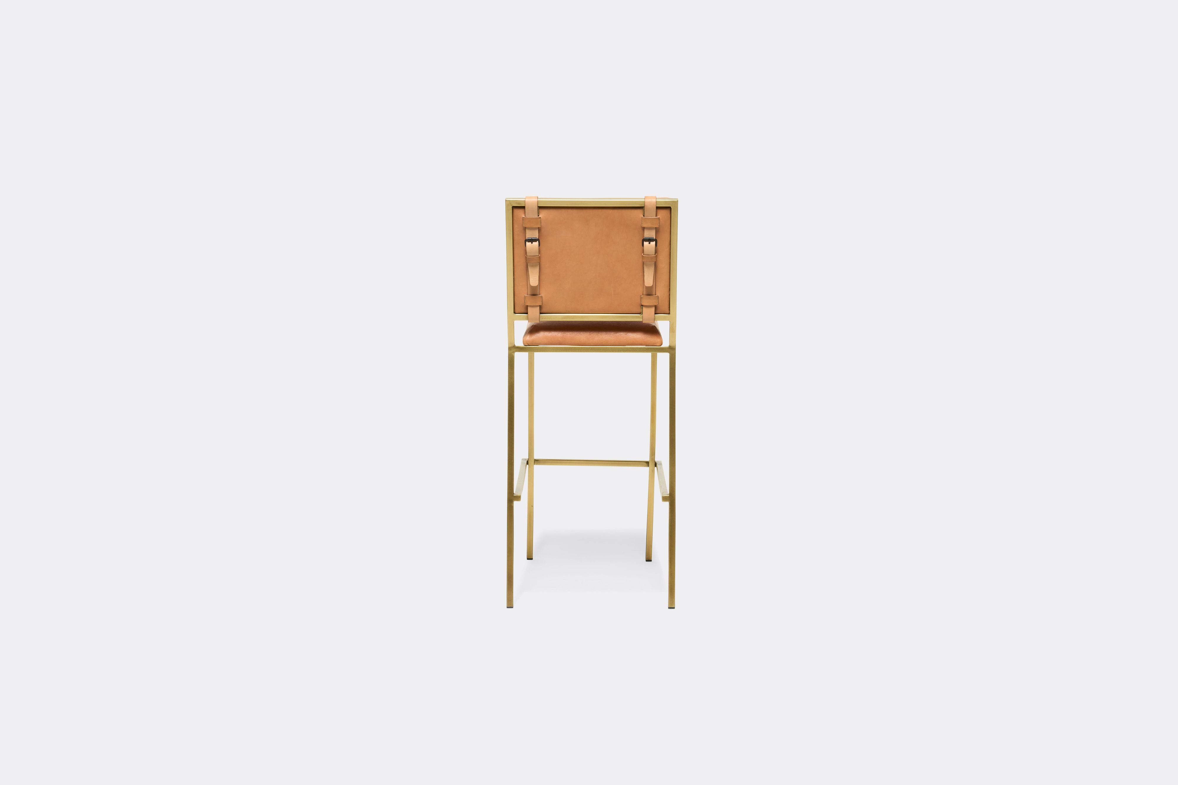 back view of veg tan leather barstool with antique brass metal frame