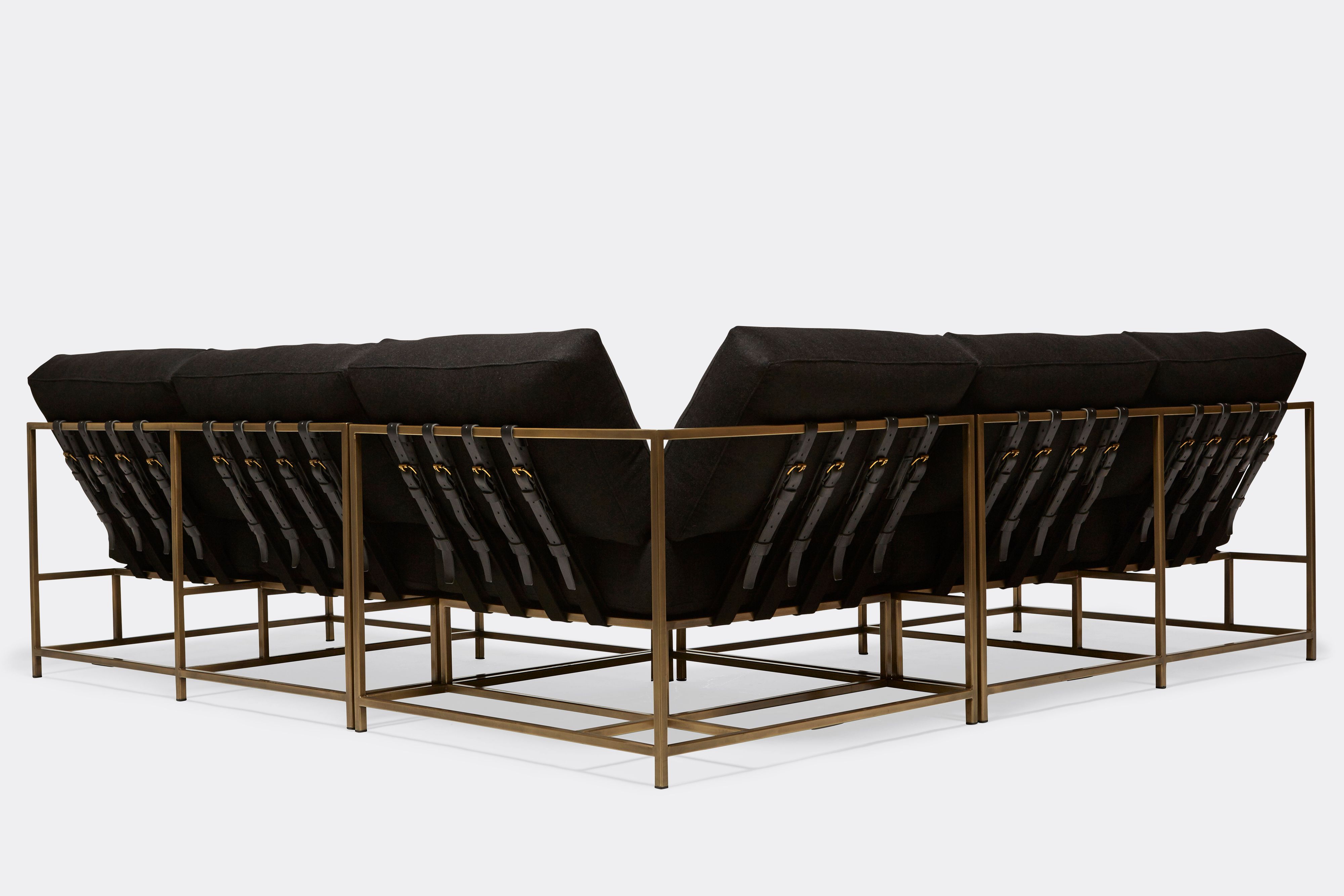 back of sectional with black wool upholstery on antique brass metal frame
