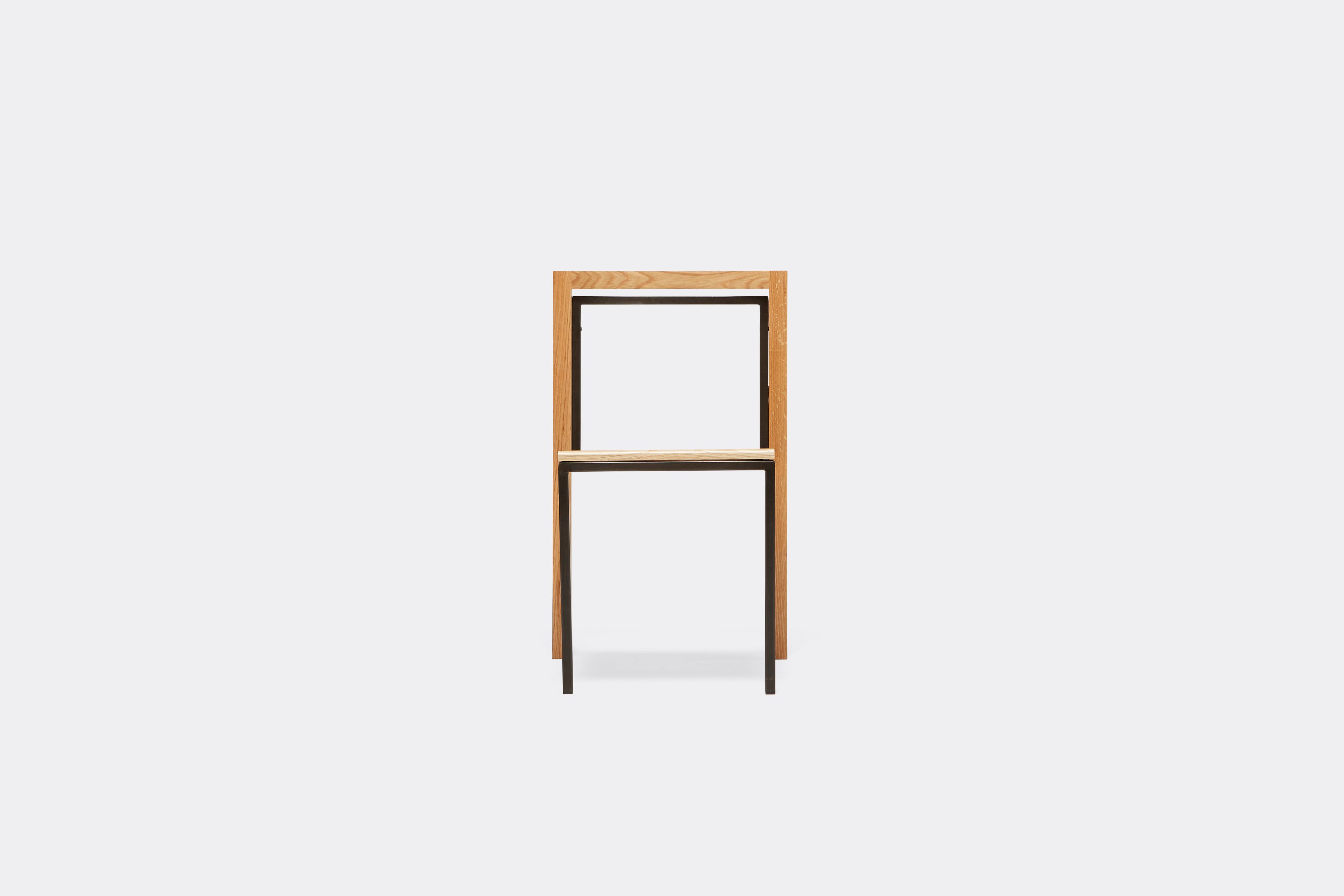 Front view of oak and blackened steel dining chair