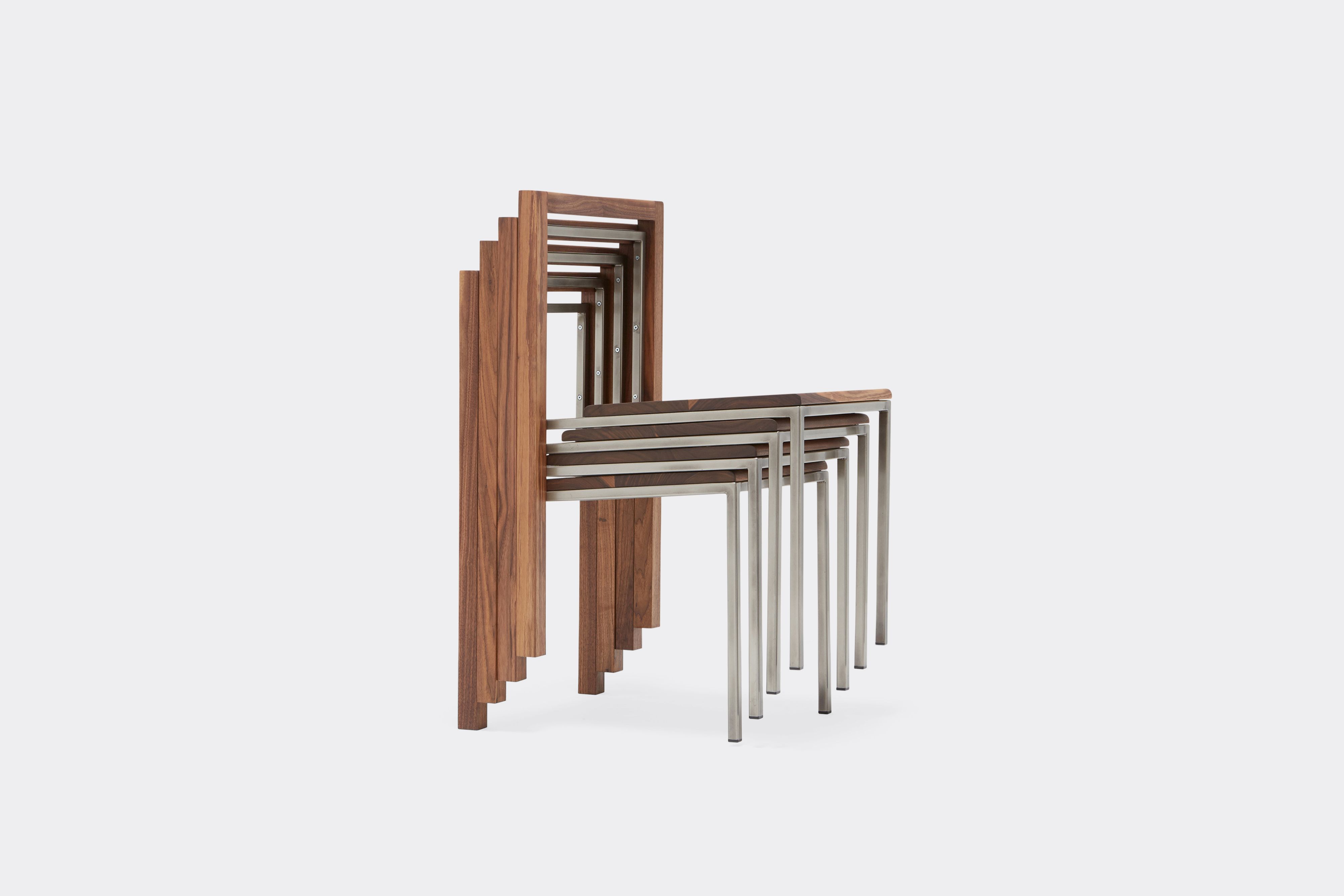 side view of walnut and antique nickel dining chair stacked