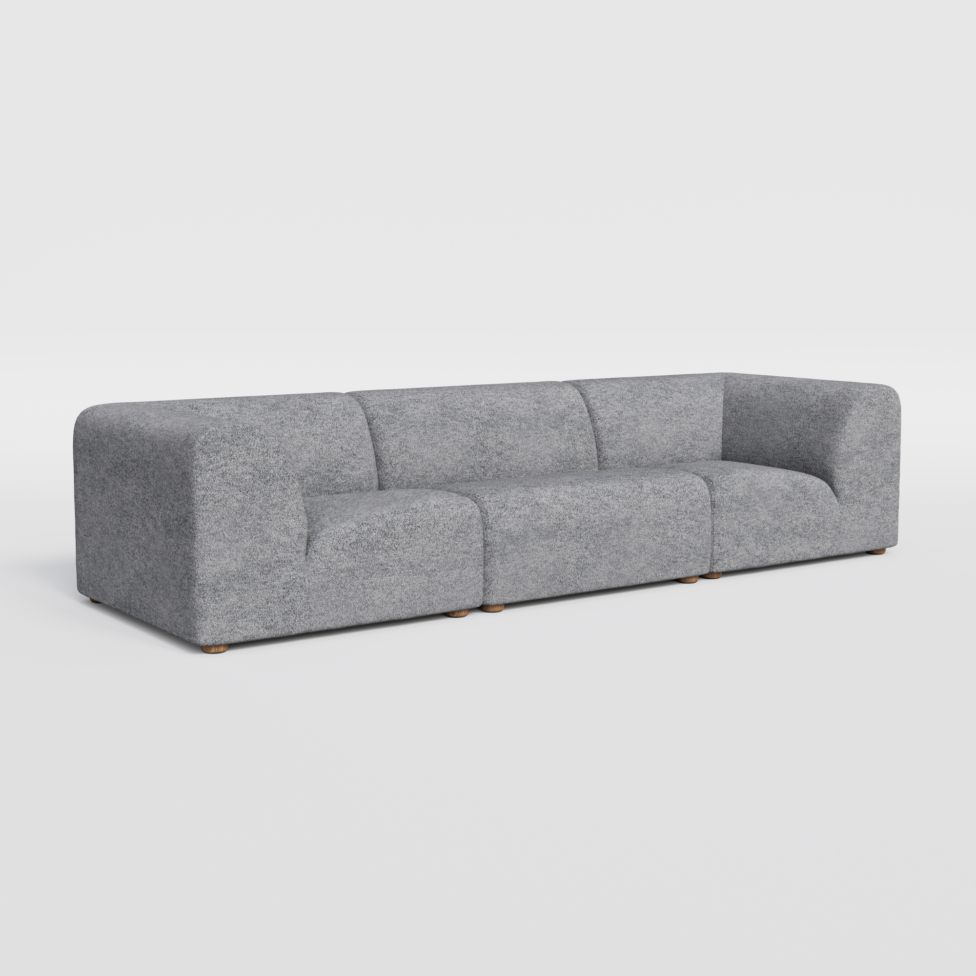 Long, light grey modular sofa with rounded edges.