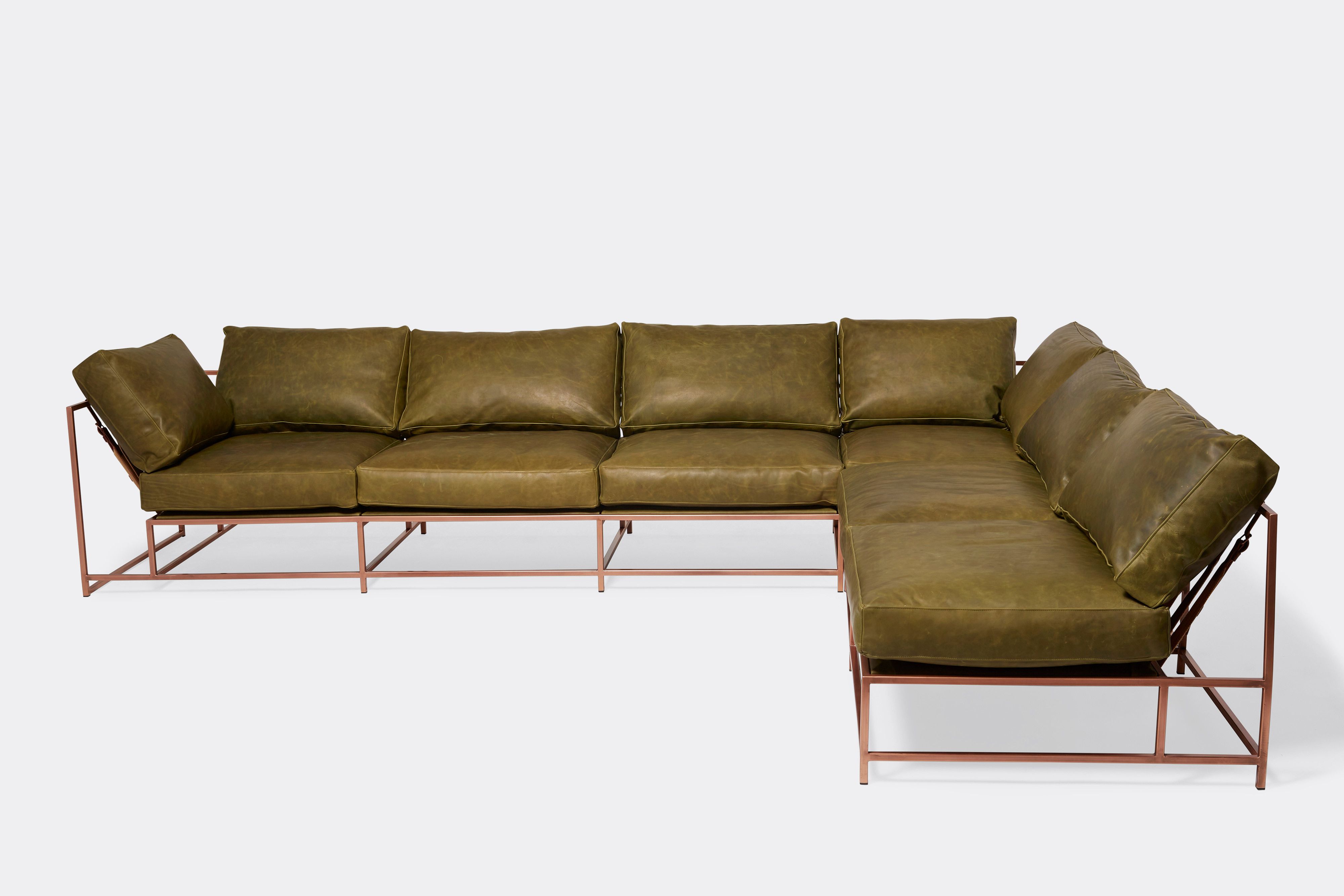 side of sectional with green leather upholstery on antique copper metal frame