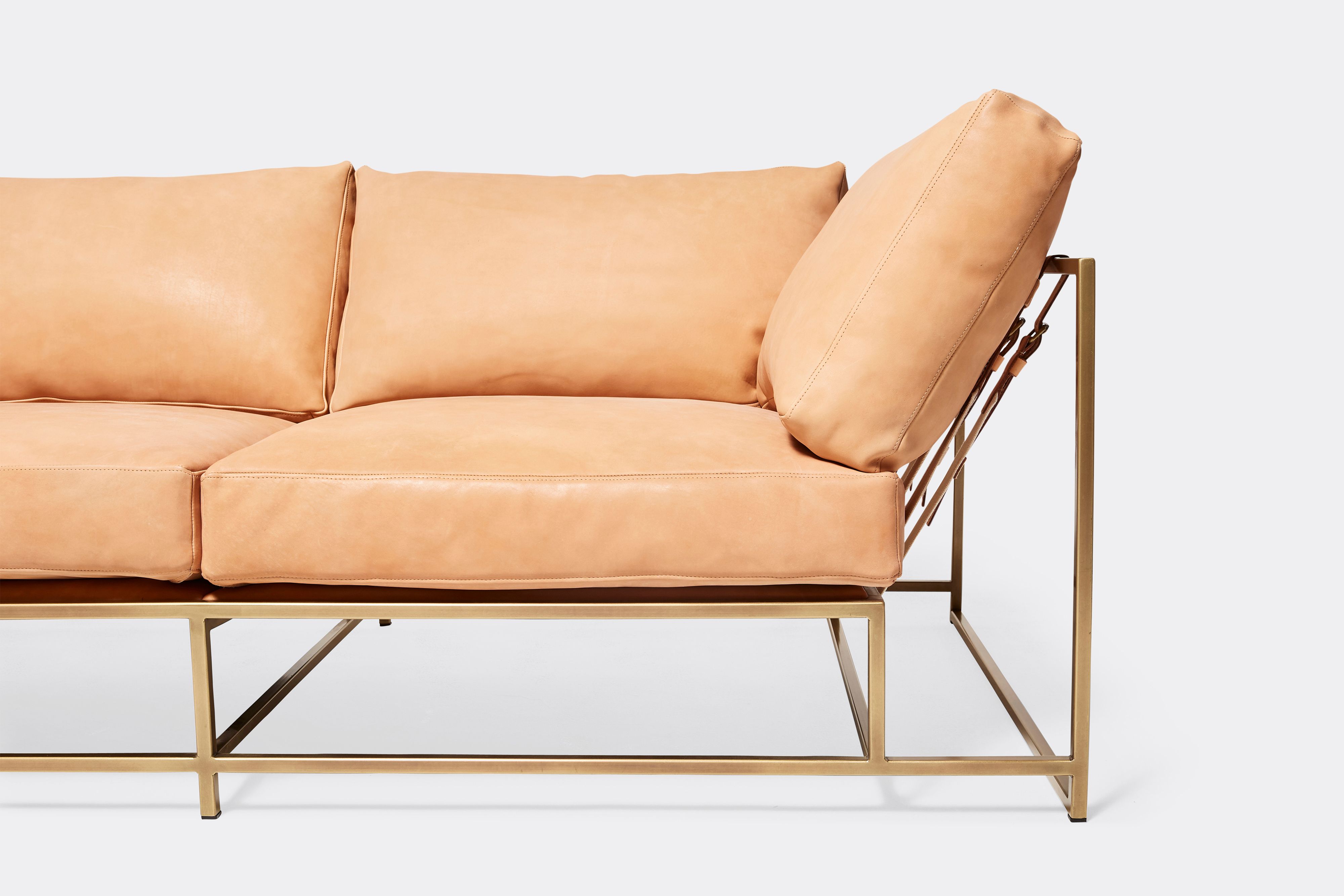 front of two seat sofa veg tan leather upholstery and antique brass metal frame