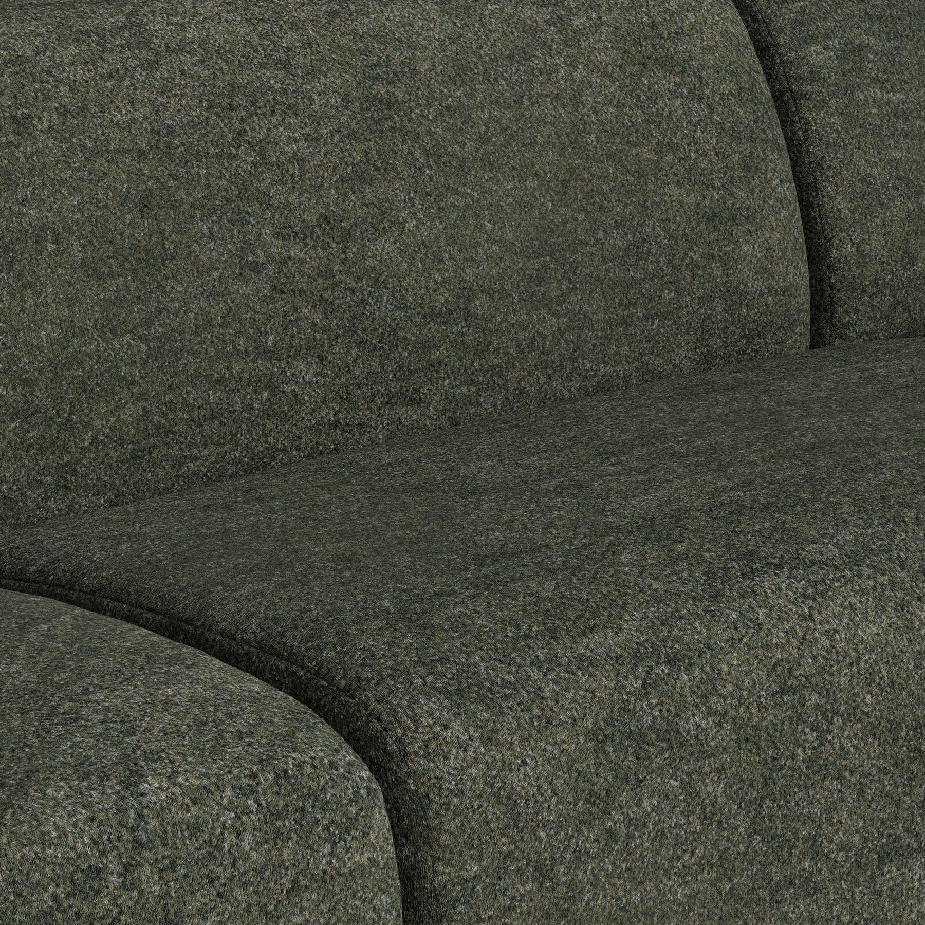 Close-up of dark green mottled upholstery with visible seams.