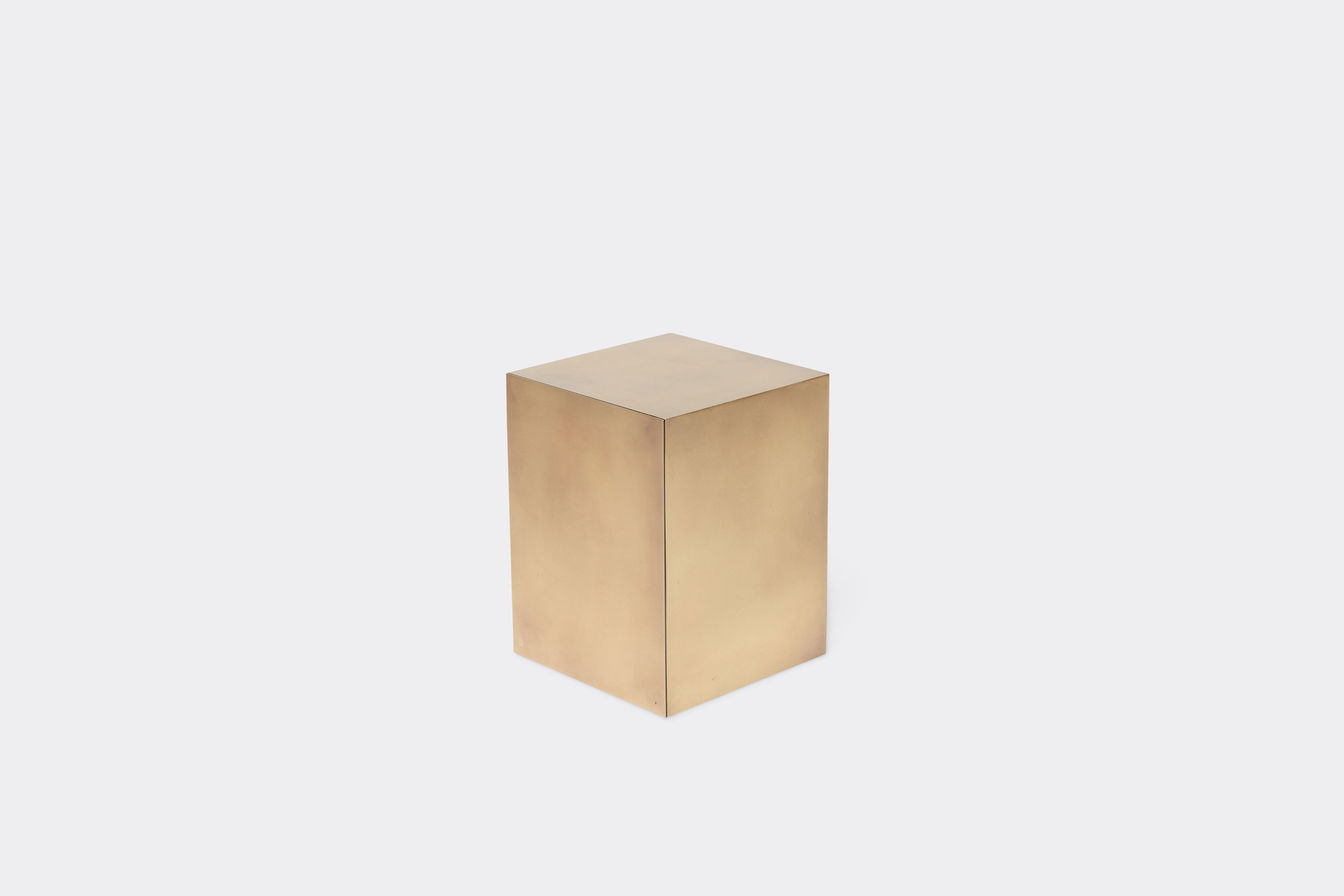 side of block table made with antique brass metal frame