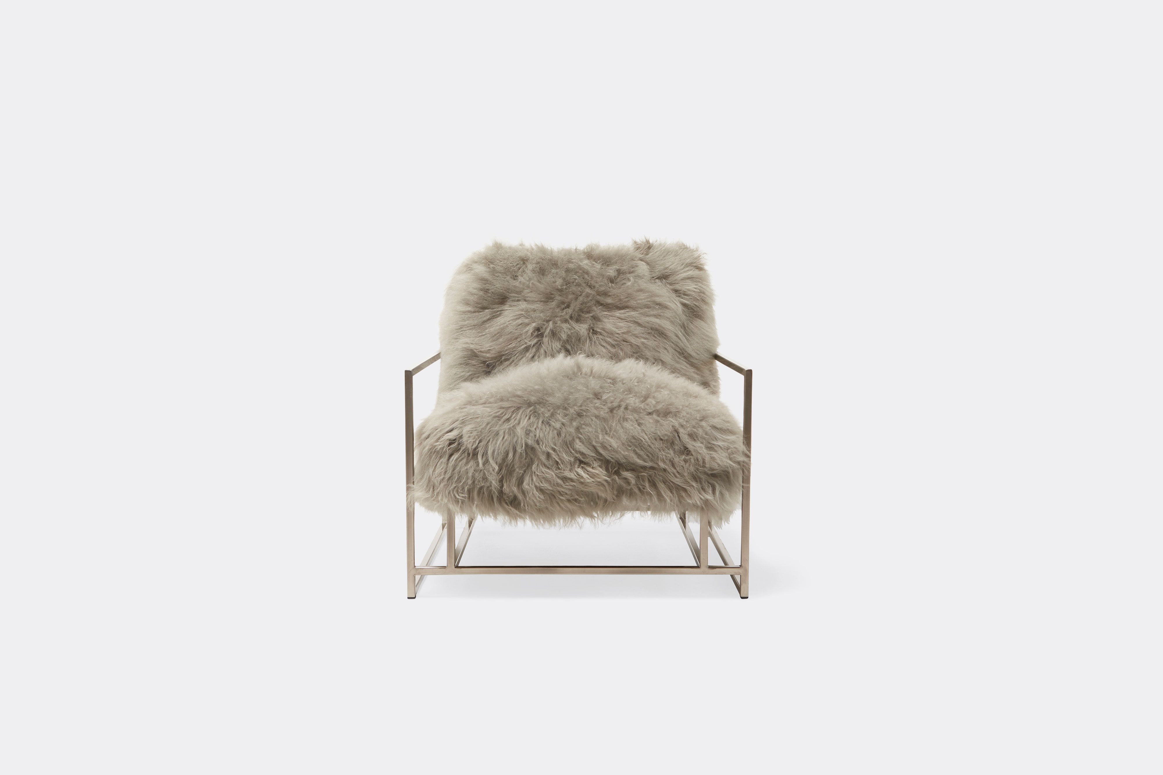 front of armchair with grey sheepskin upholstery on antique nickel frame