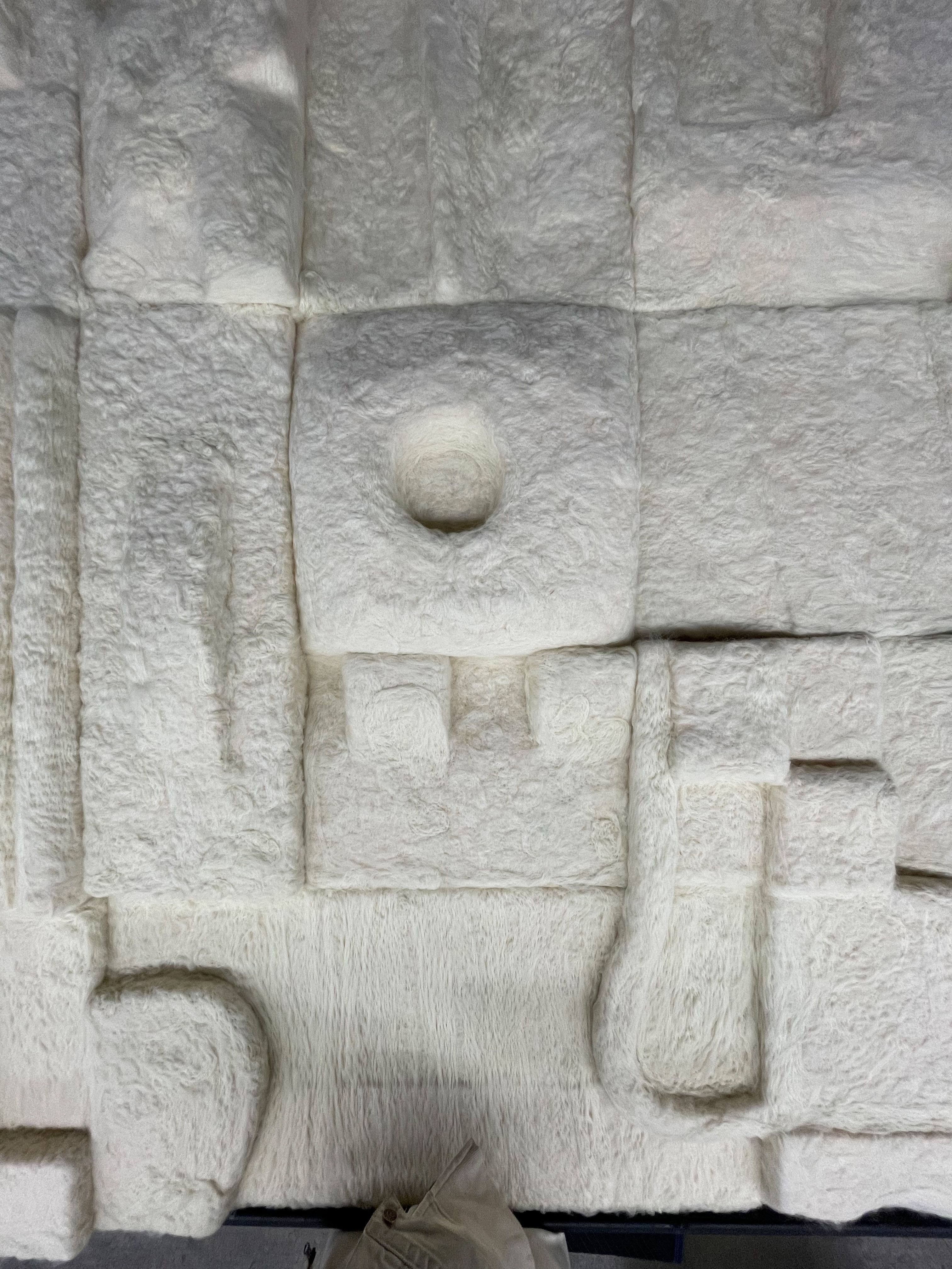 a close up of a white foam sculpture
