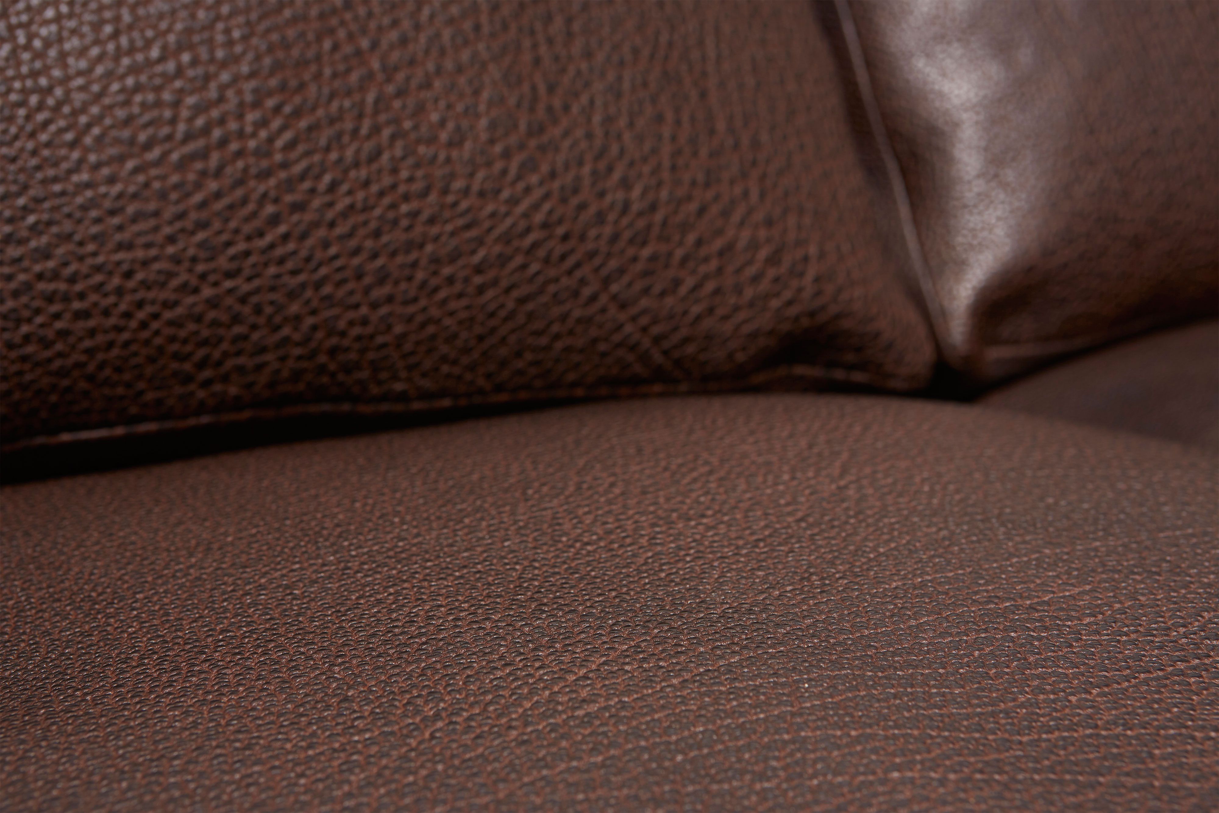 close up detailed view of brown leather sofa.
