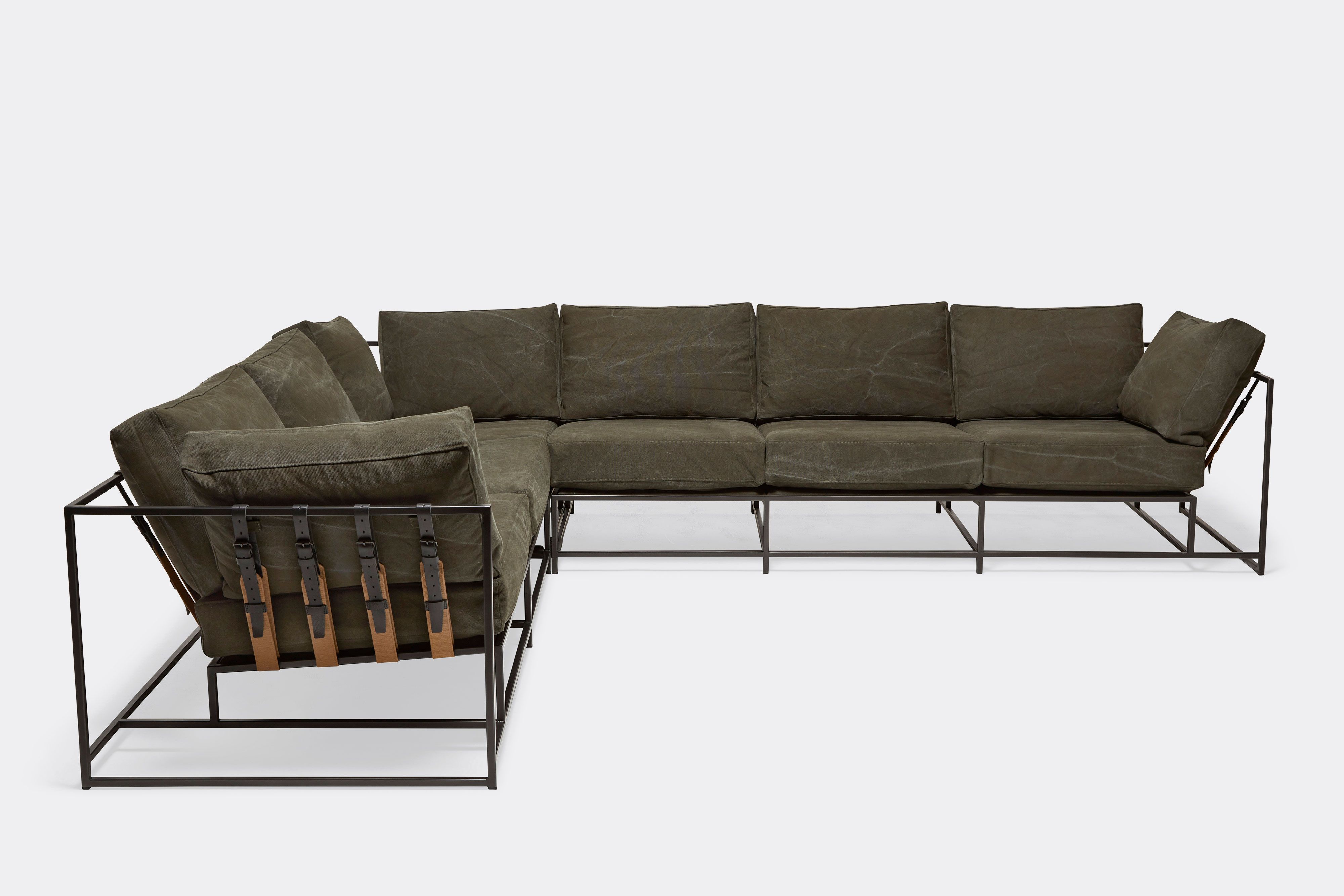 side of sectional with olive canvas upholstery on blackened steel metal frame