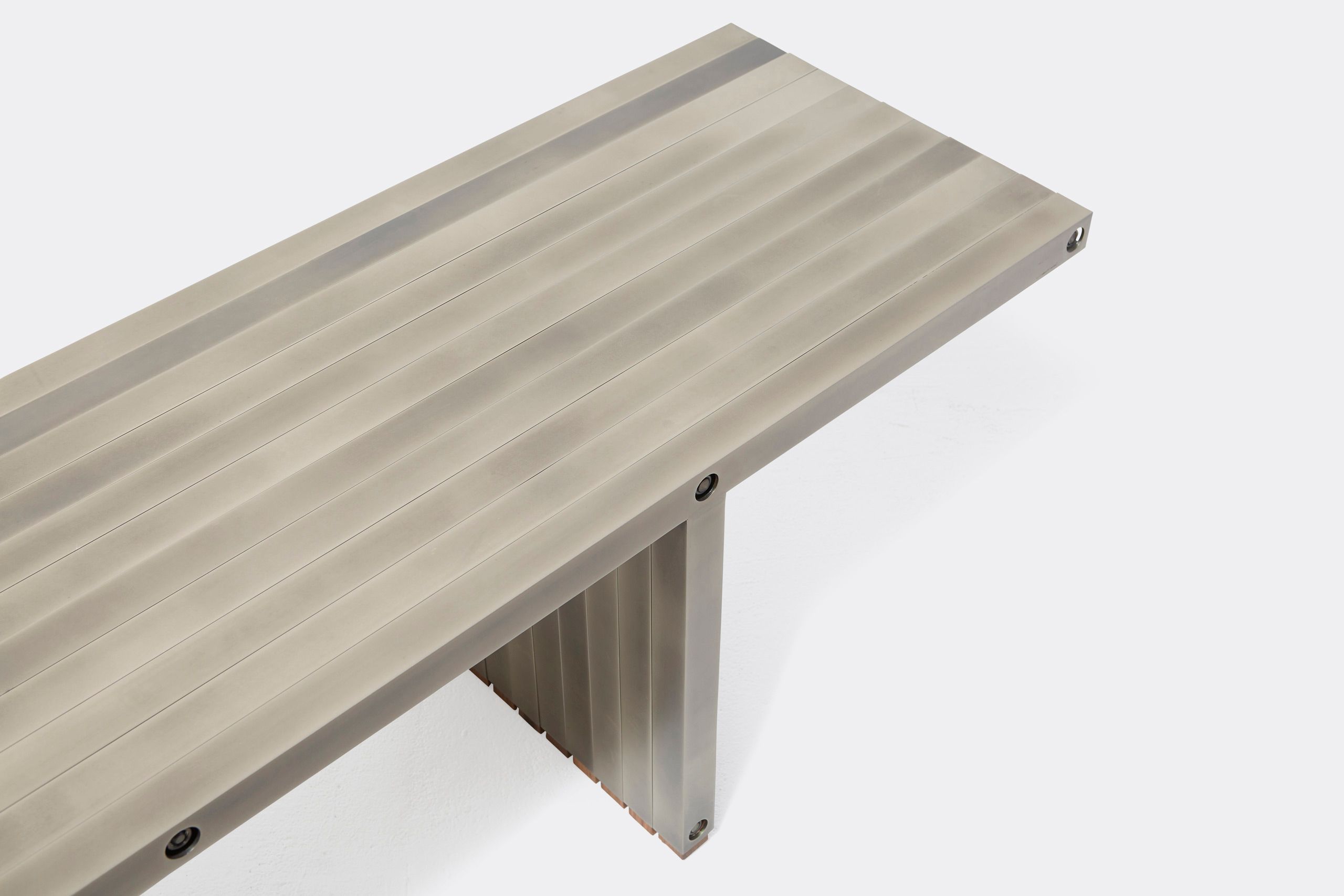 a steel bench shown on a white background .