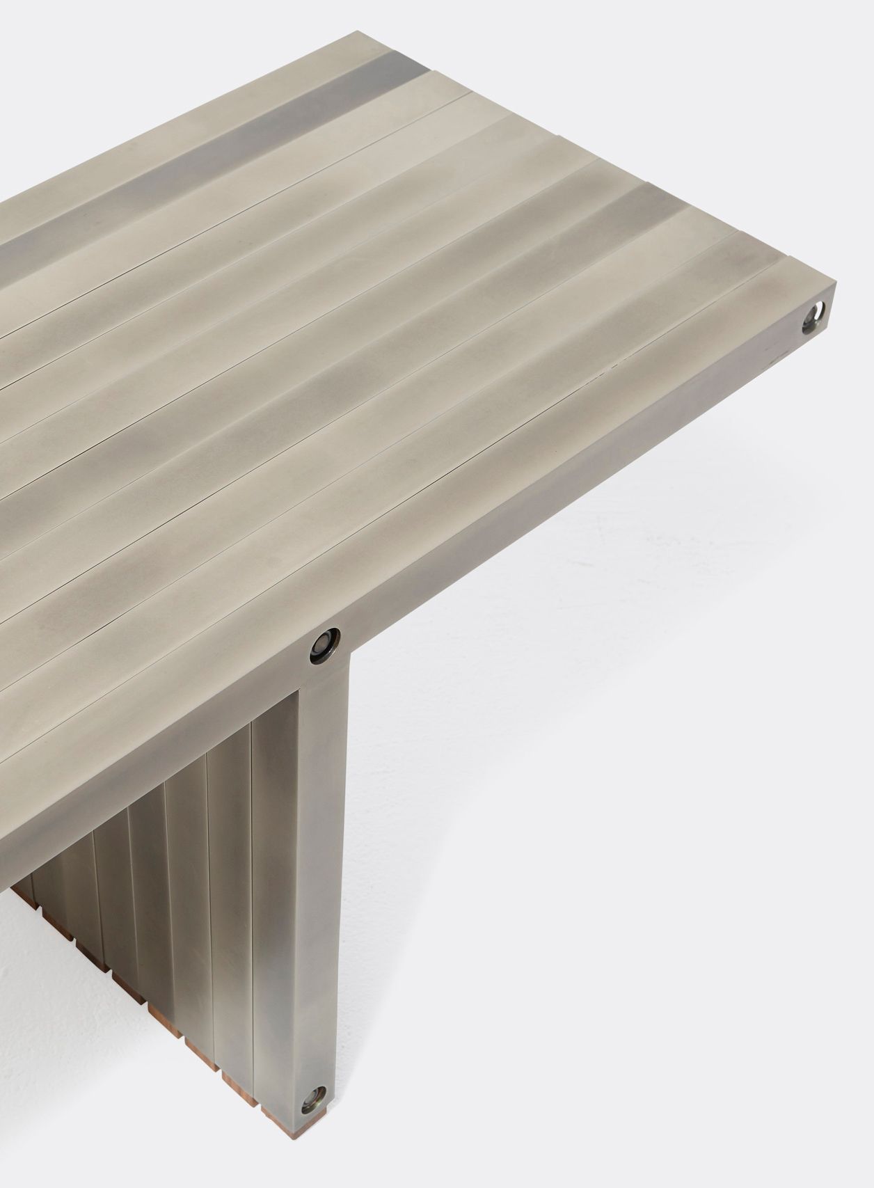 a steel bench shown on a white background .