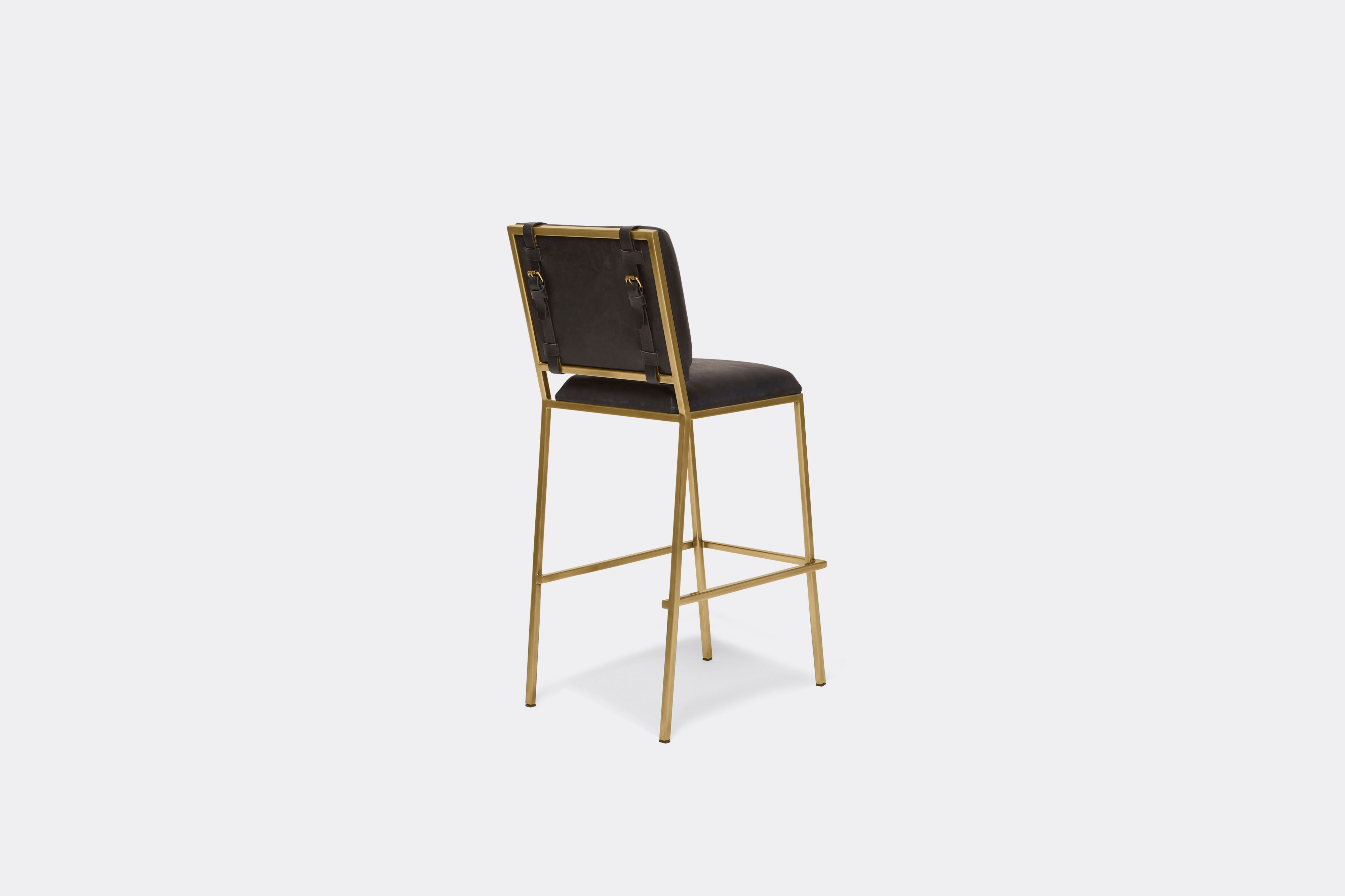 Back view of black leather barstool with antique brass metal frame