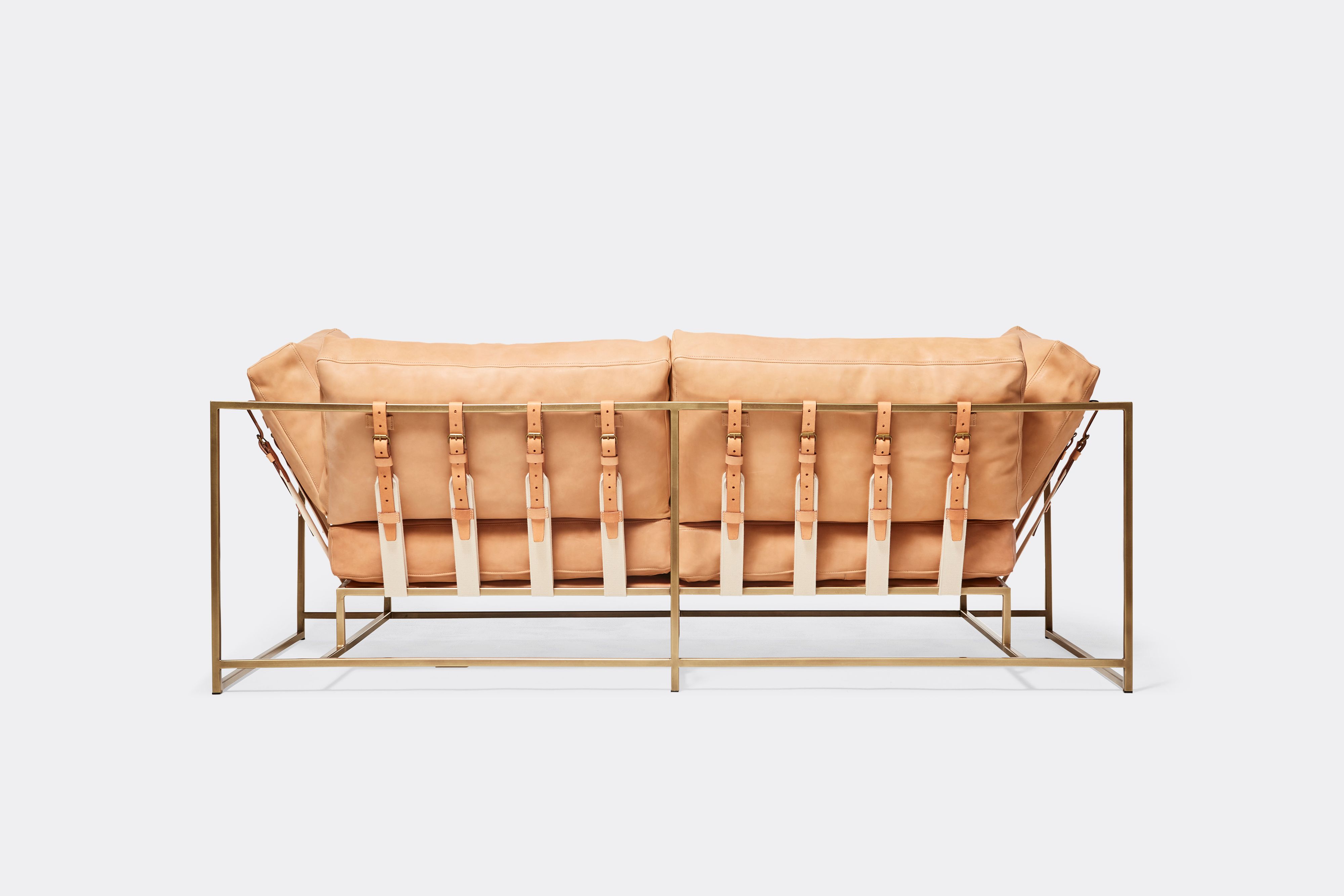 back of two seat sofa veg tan leather upholstery and veg tan leather belts on antique brass metal frame