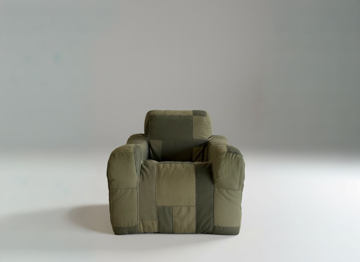 Green patchwork armchair in a studio.