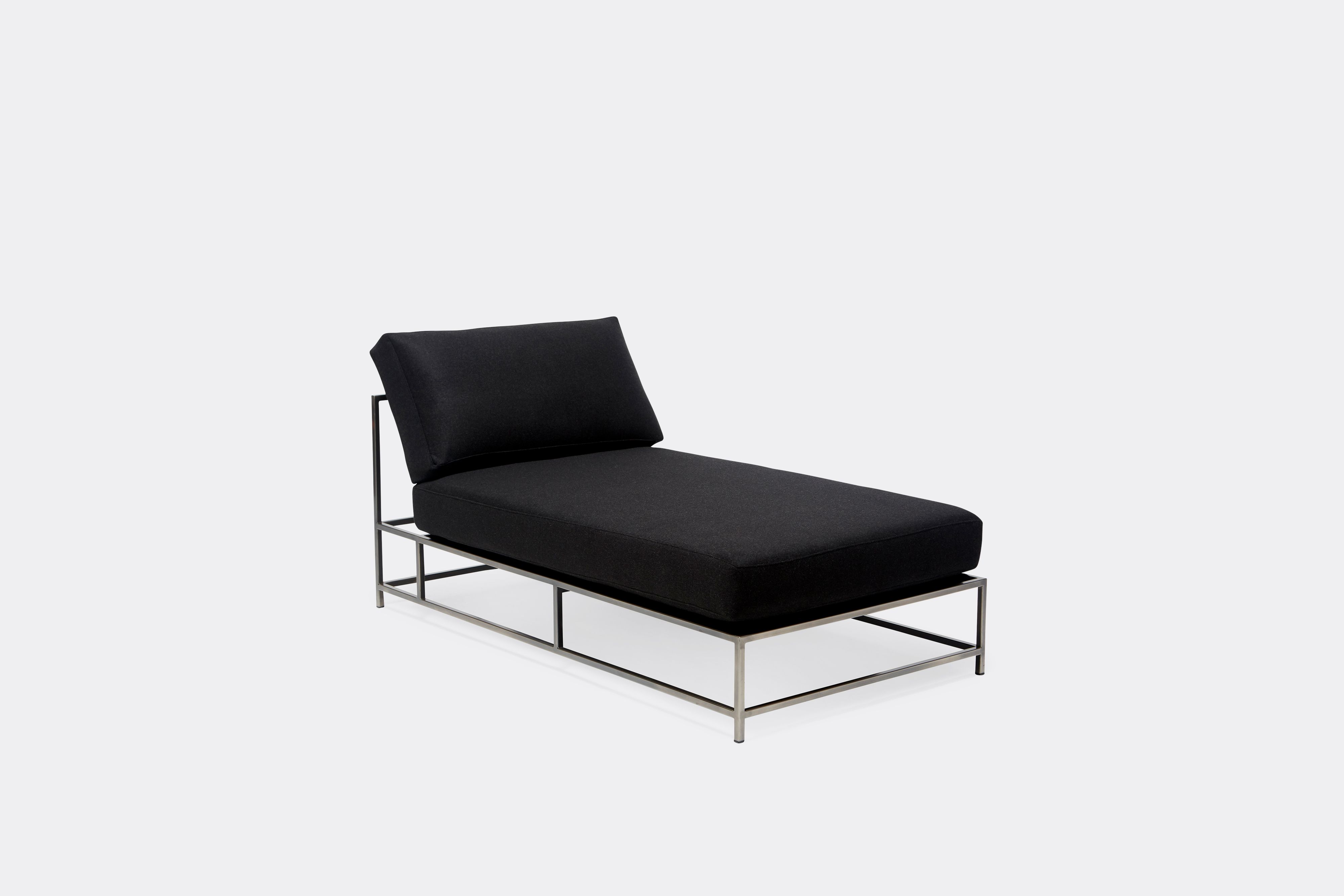 front of chaise lounge with black wool upholstery on antique nickel metal frame