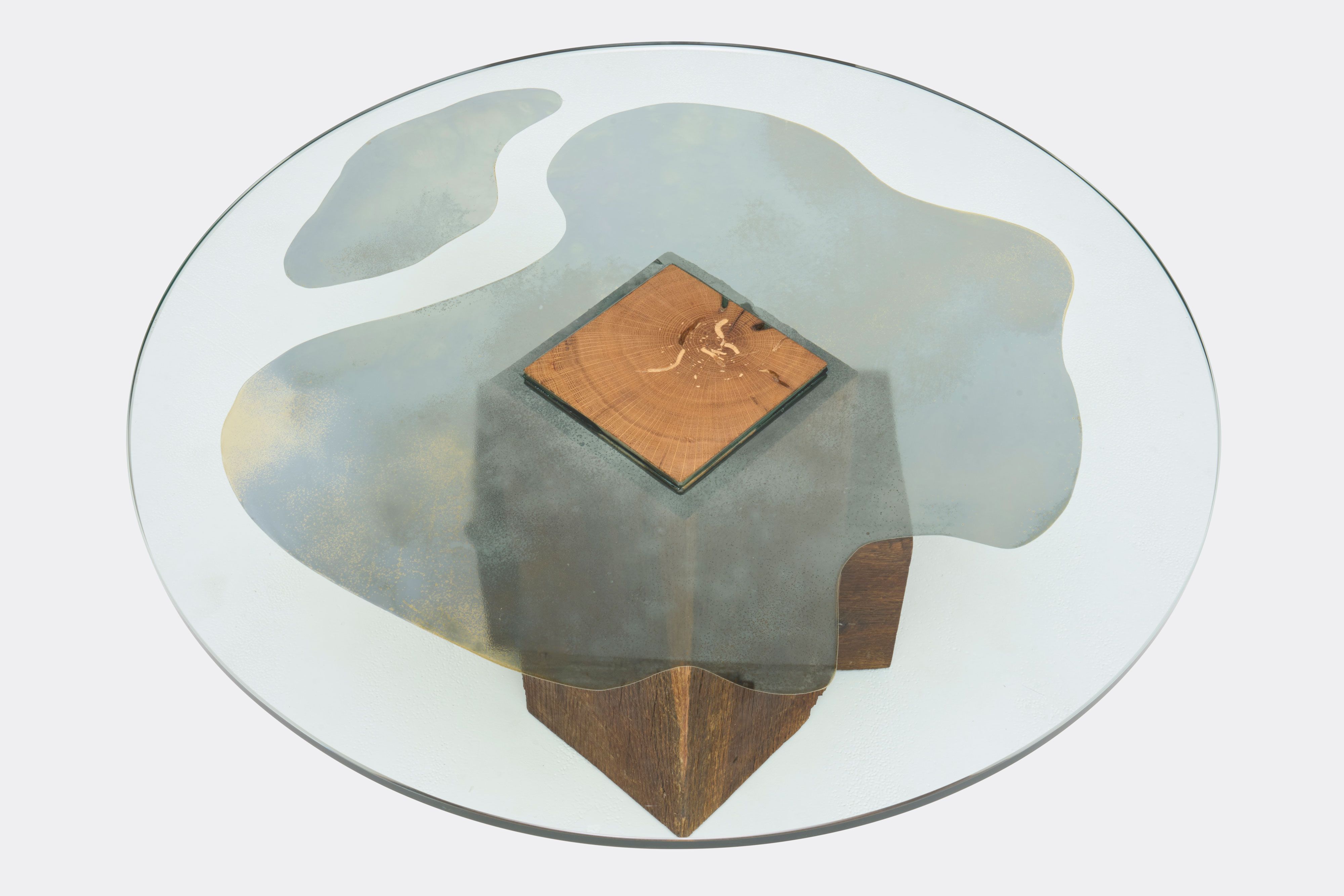 a glass table with a wooden base and mirror on the glass on a white background