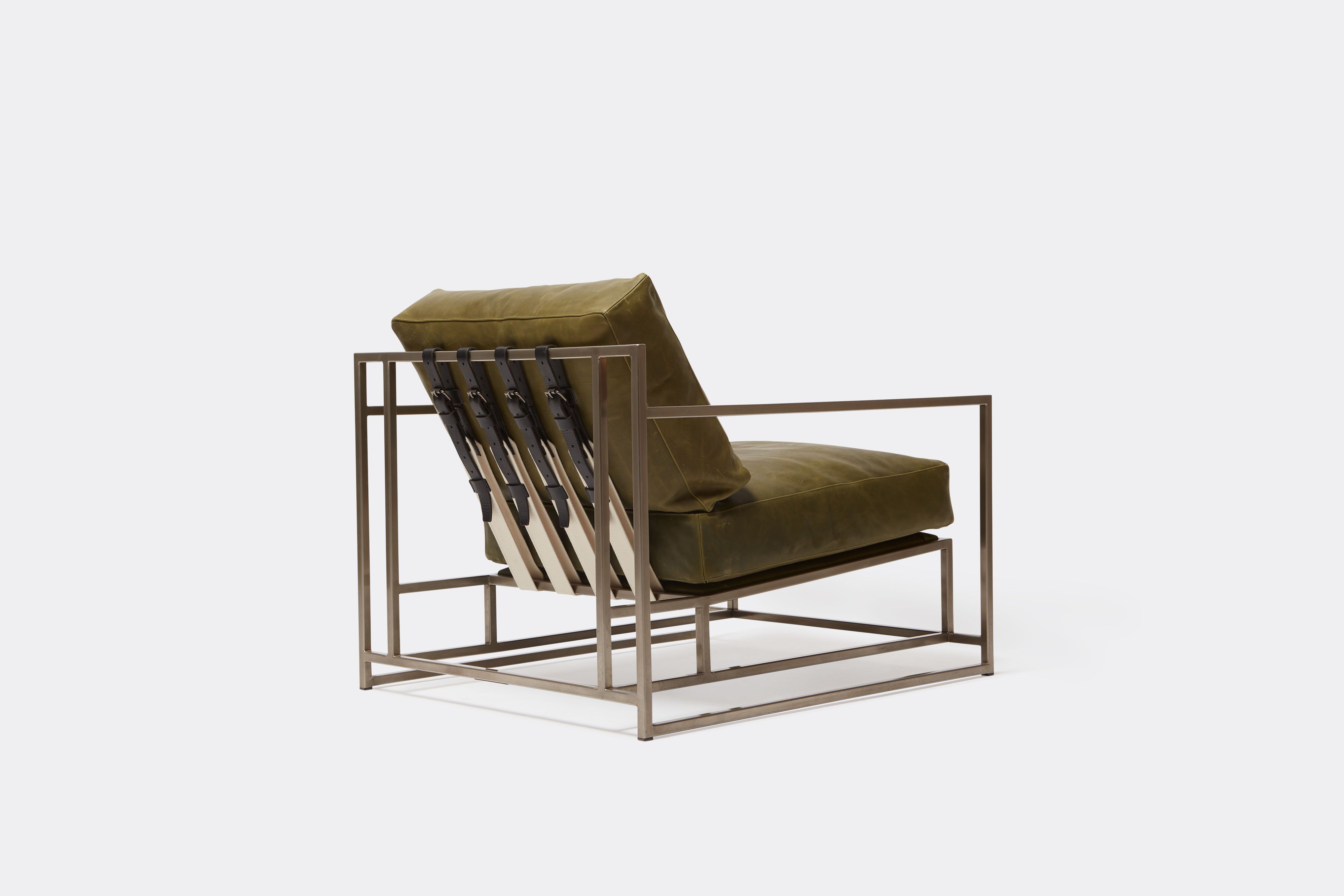 back view of green leather chair with antique nickel frame and leather belts