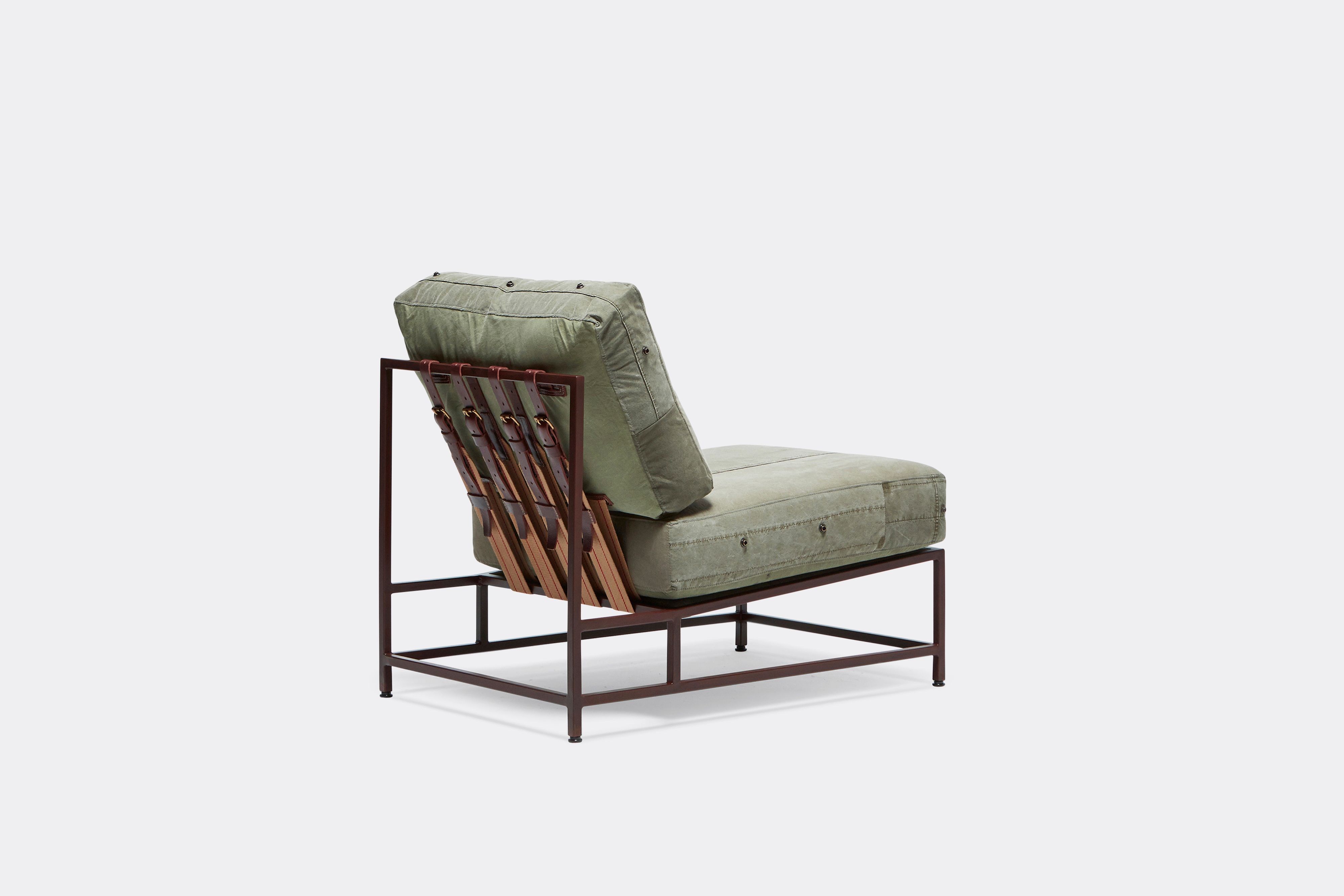 back view of military canvas chair with marbled rust frame and leather belt