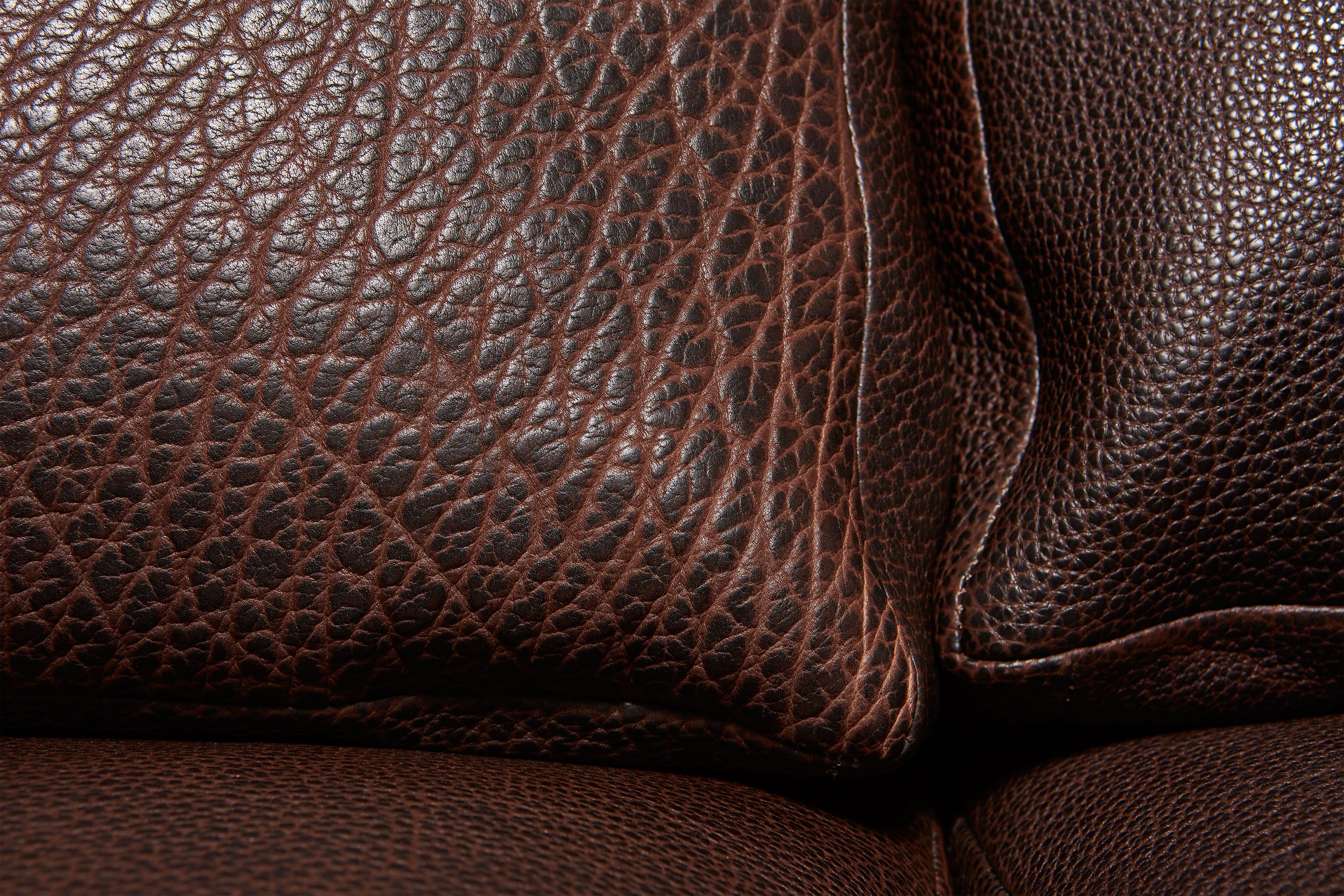 close up detailed view of brown leather sofa.