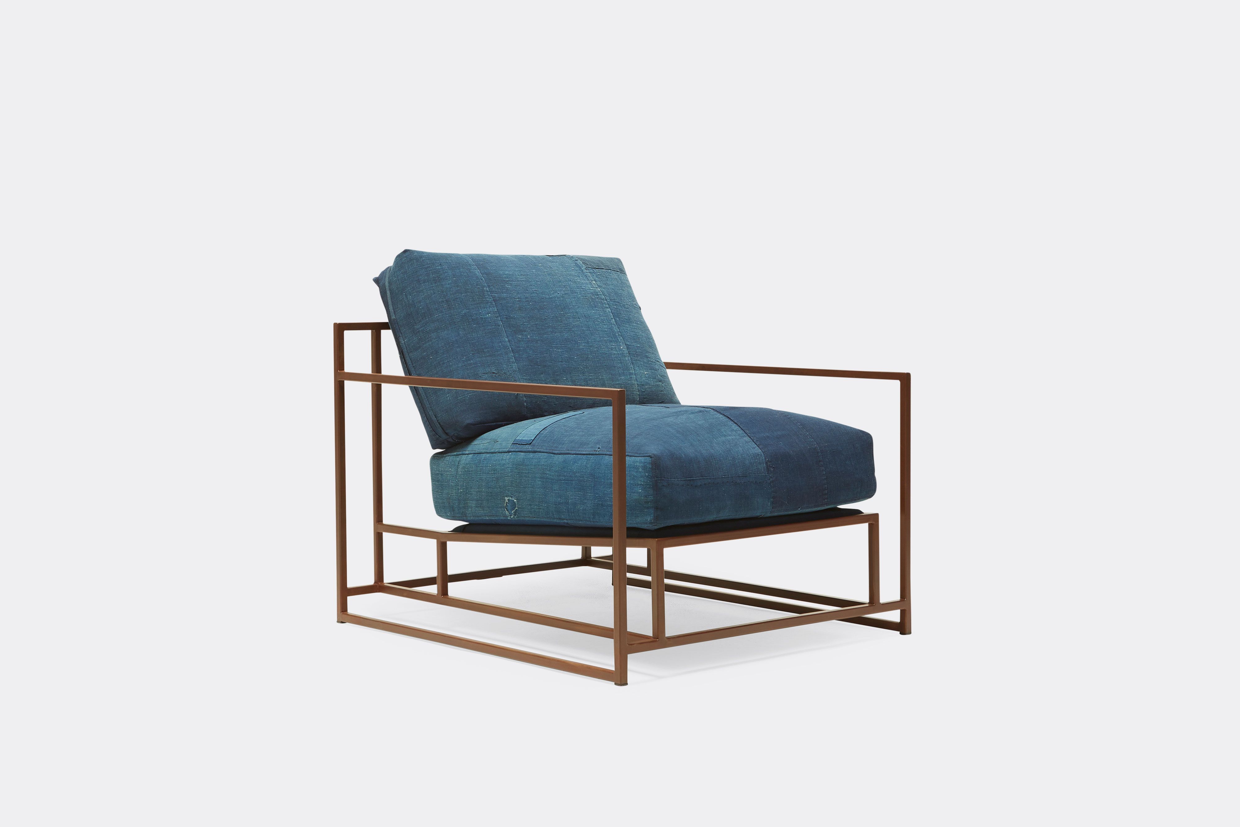 side of armchair with vintage boro upholstery on marbled rust metal frame