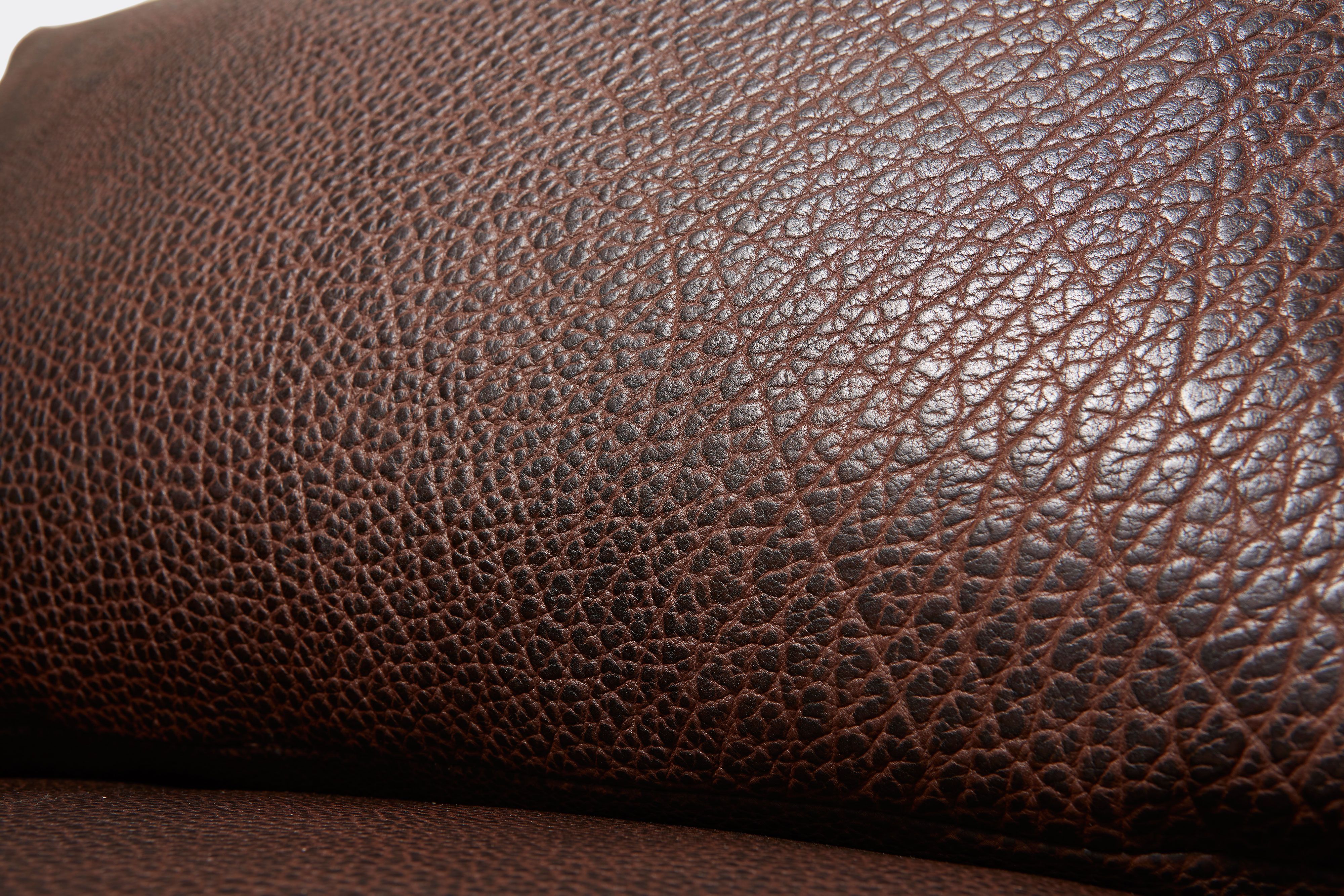close up detailed view of brown leather sofa.