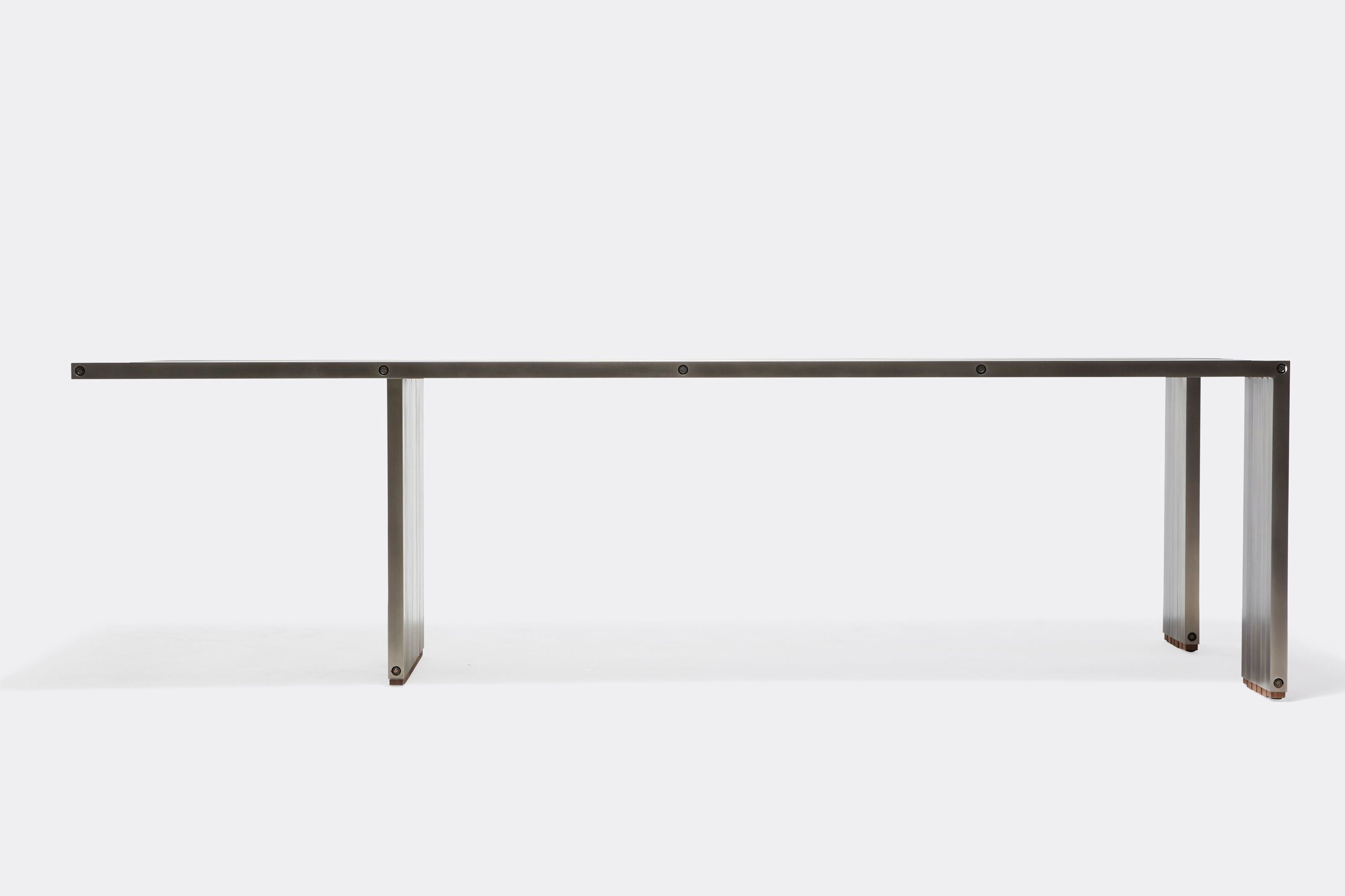 a long table with a metal frame and a wooden top on a white background