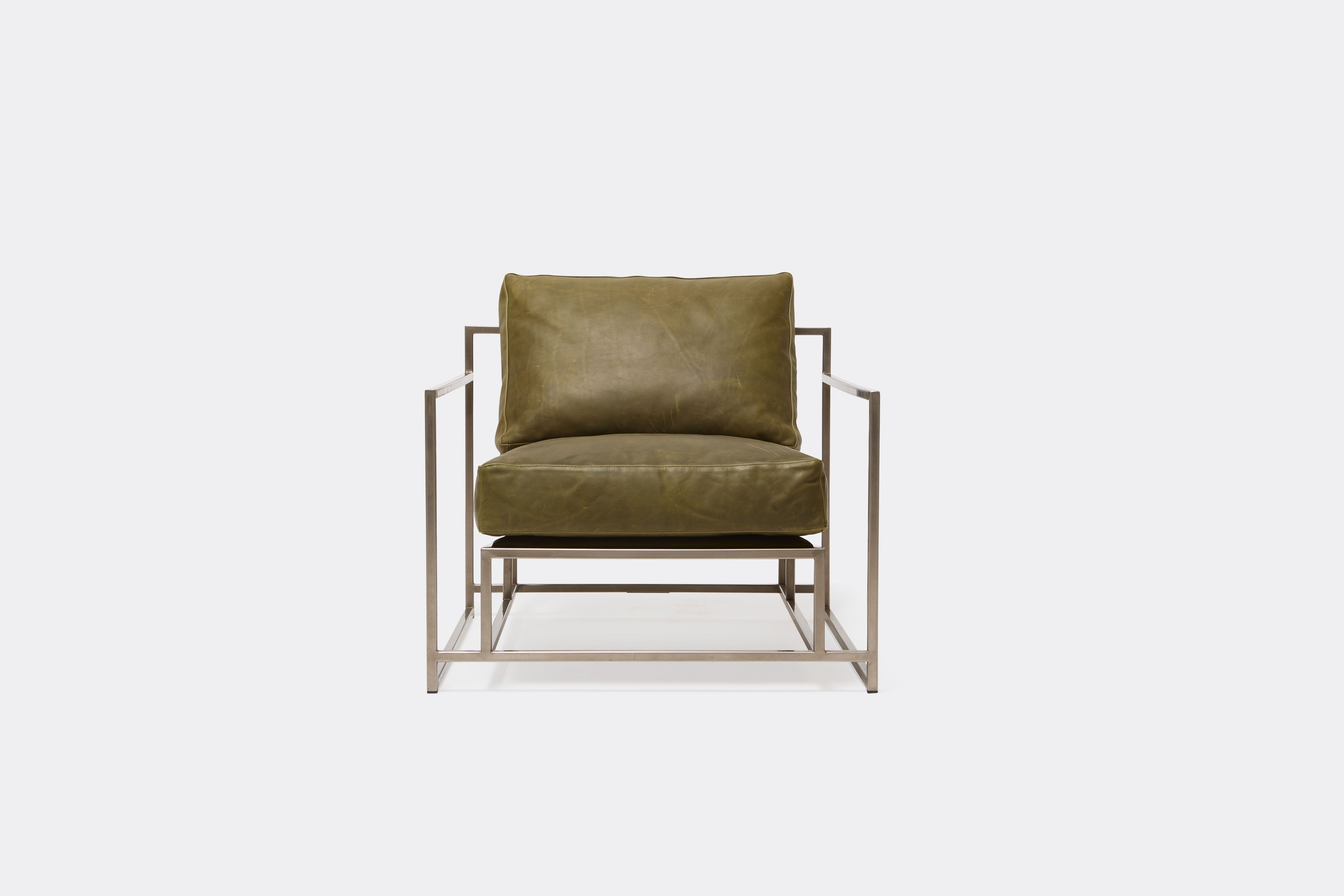 front view of green leather chair with antique nickel frame