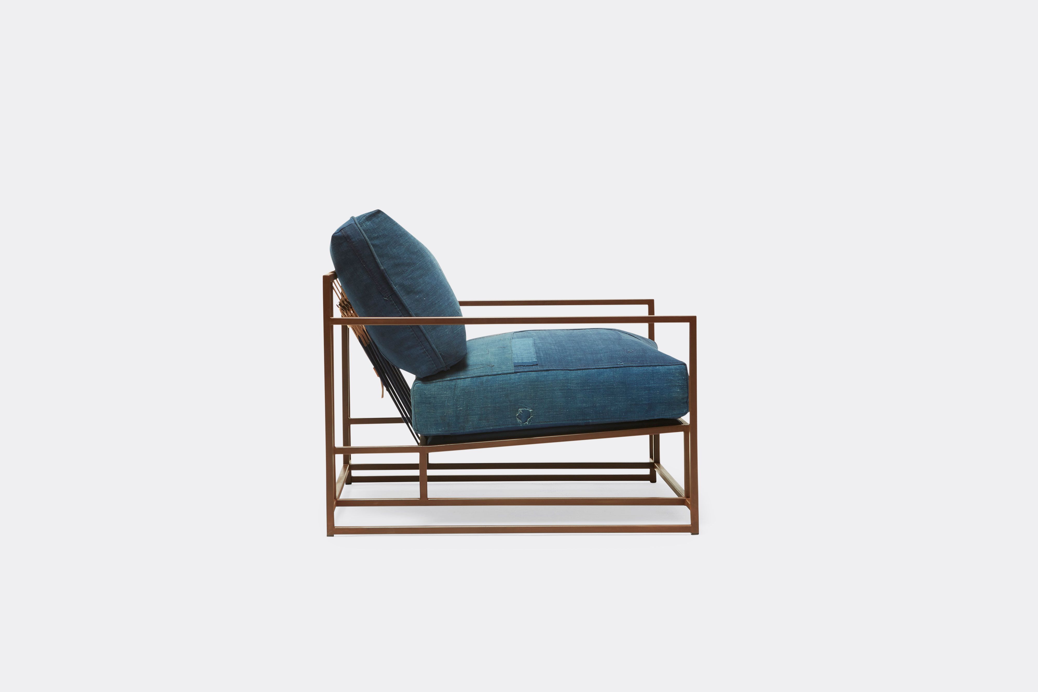 side of armchair with vintage boro upholstery on marbled rust metal frame