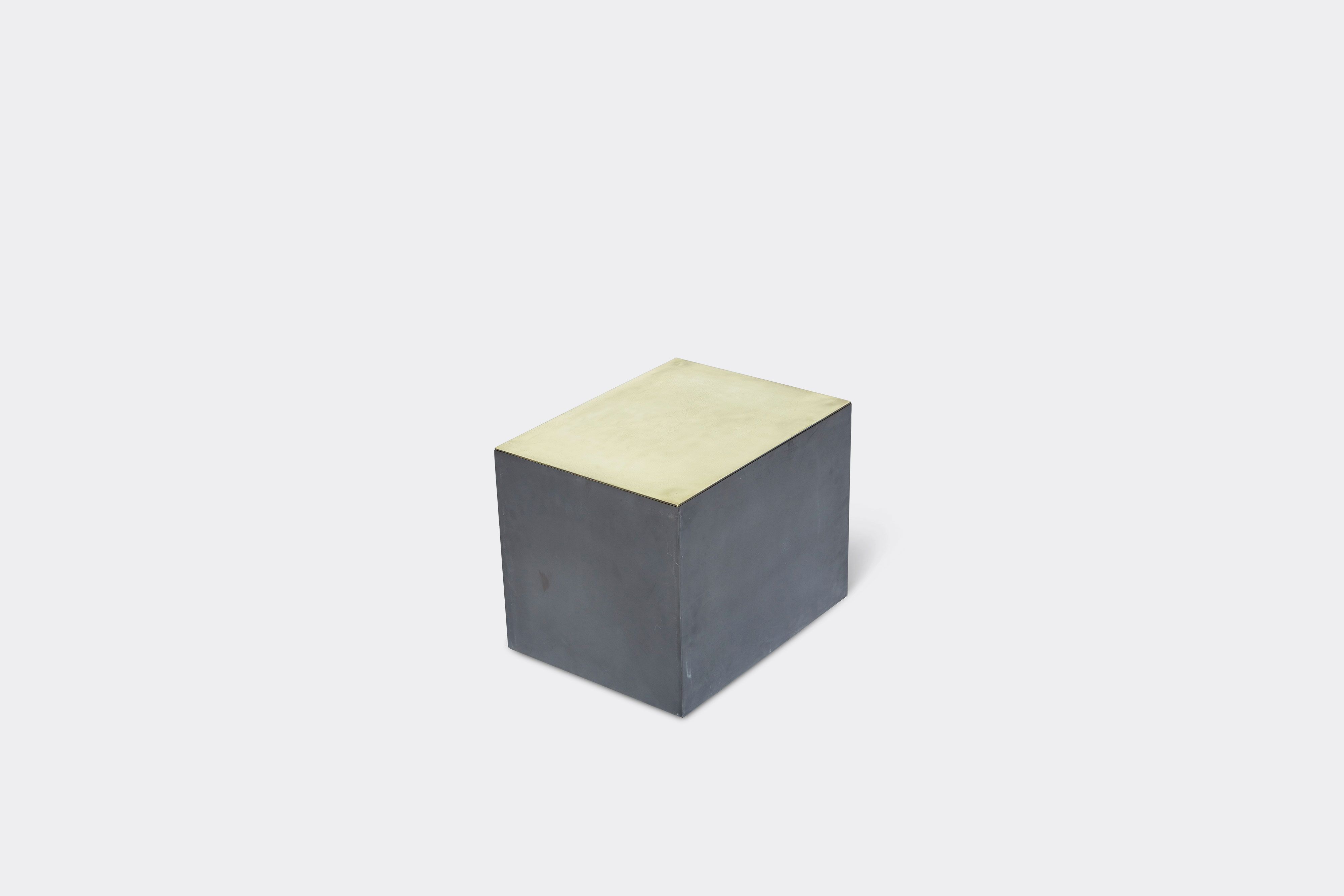 overhead of block table made with tarnished brass and black metal frame