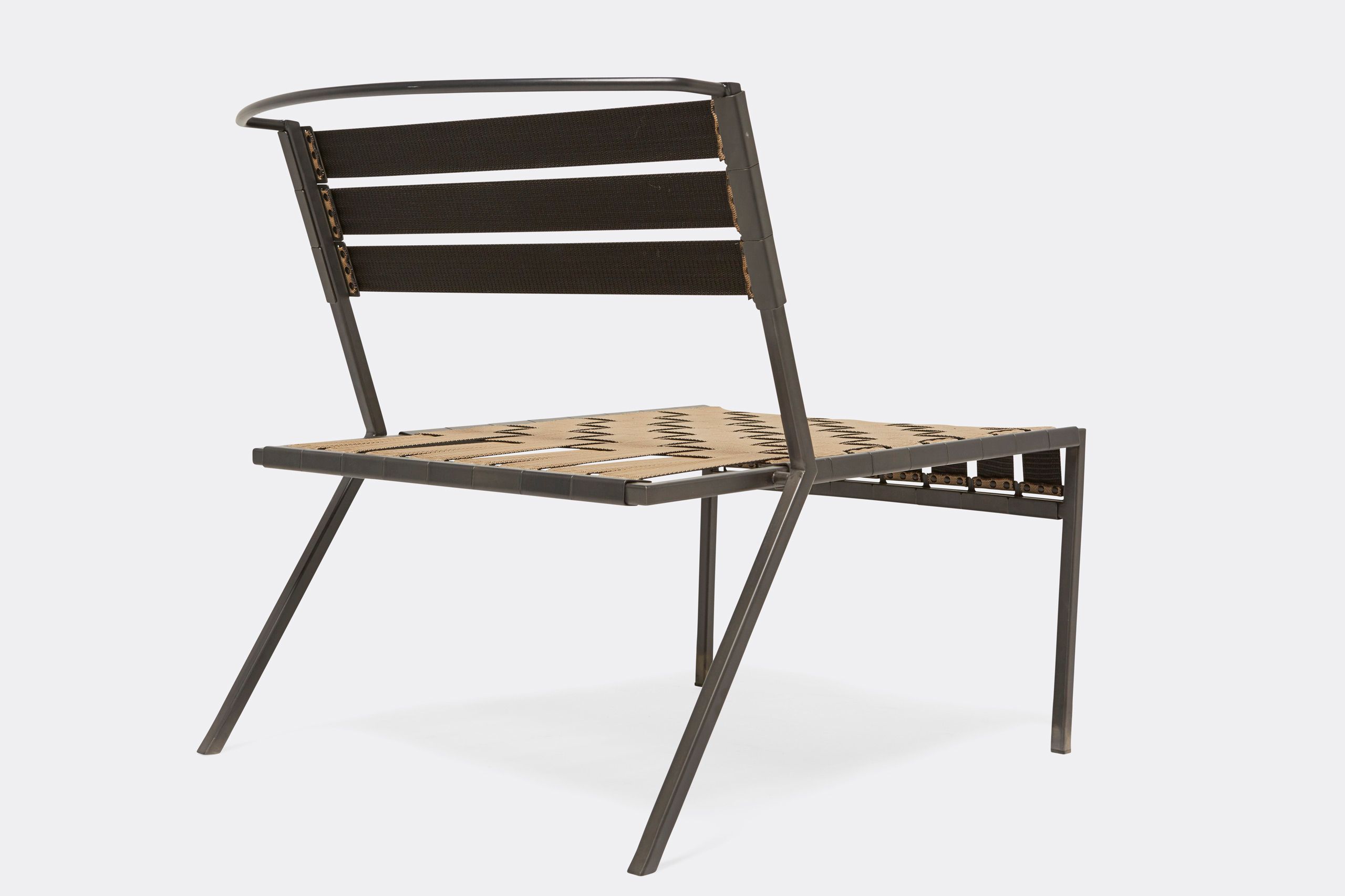 An outdoor steel chair with black metal finish and interwoven tan webbing on a light background