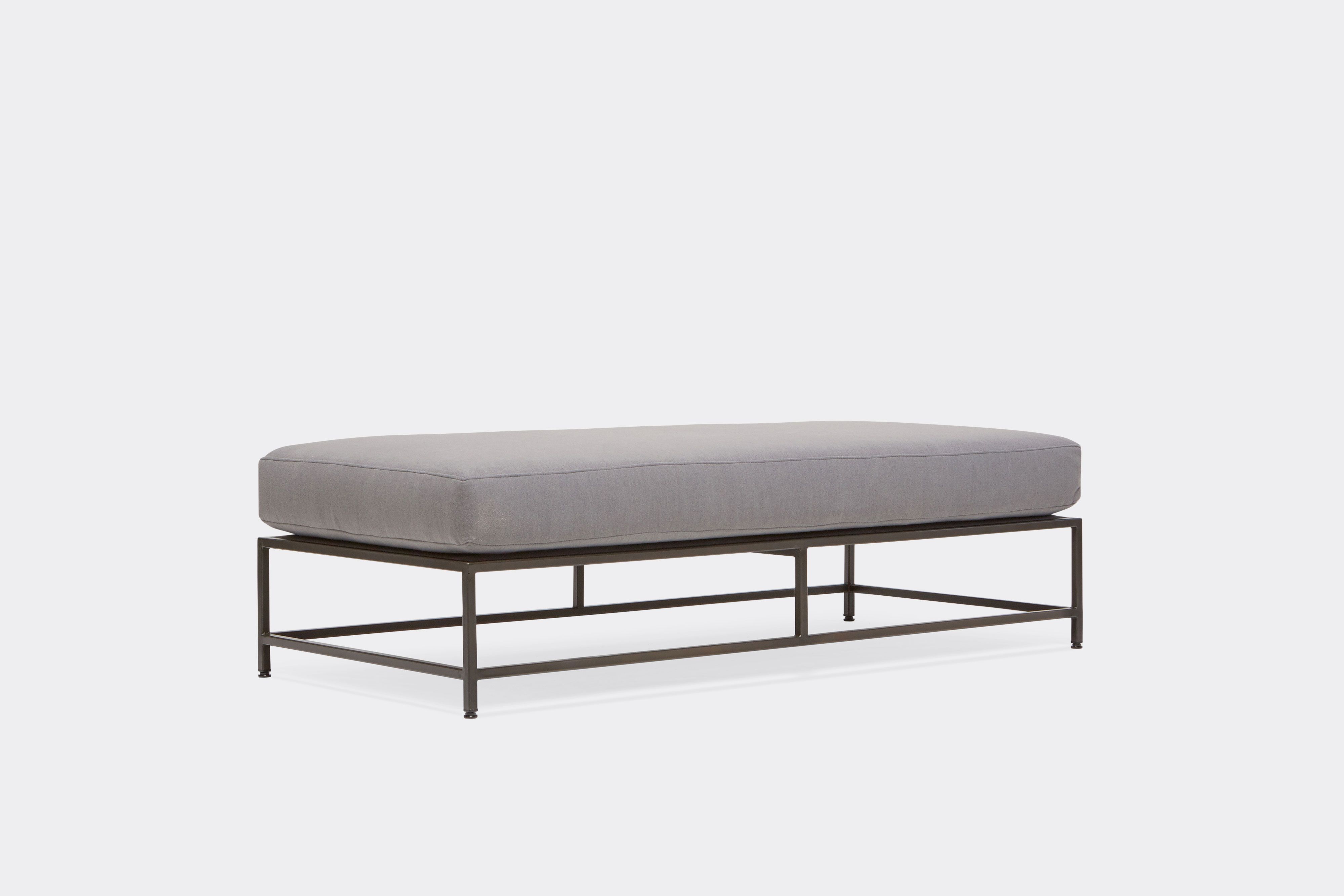 front of bench with grey wool upholstery on black metal frame