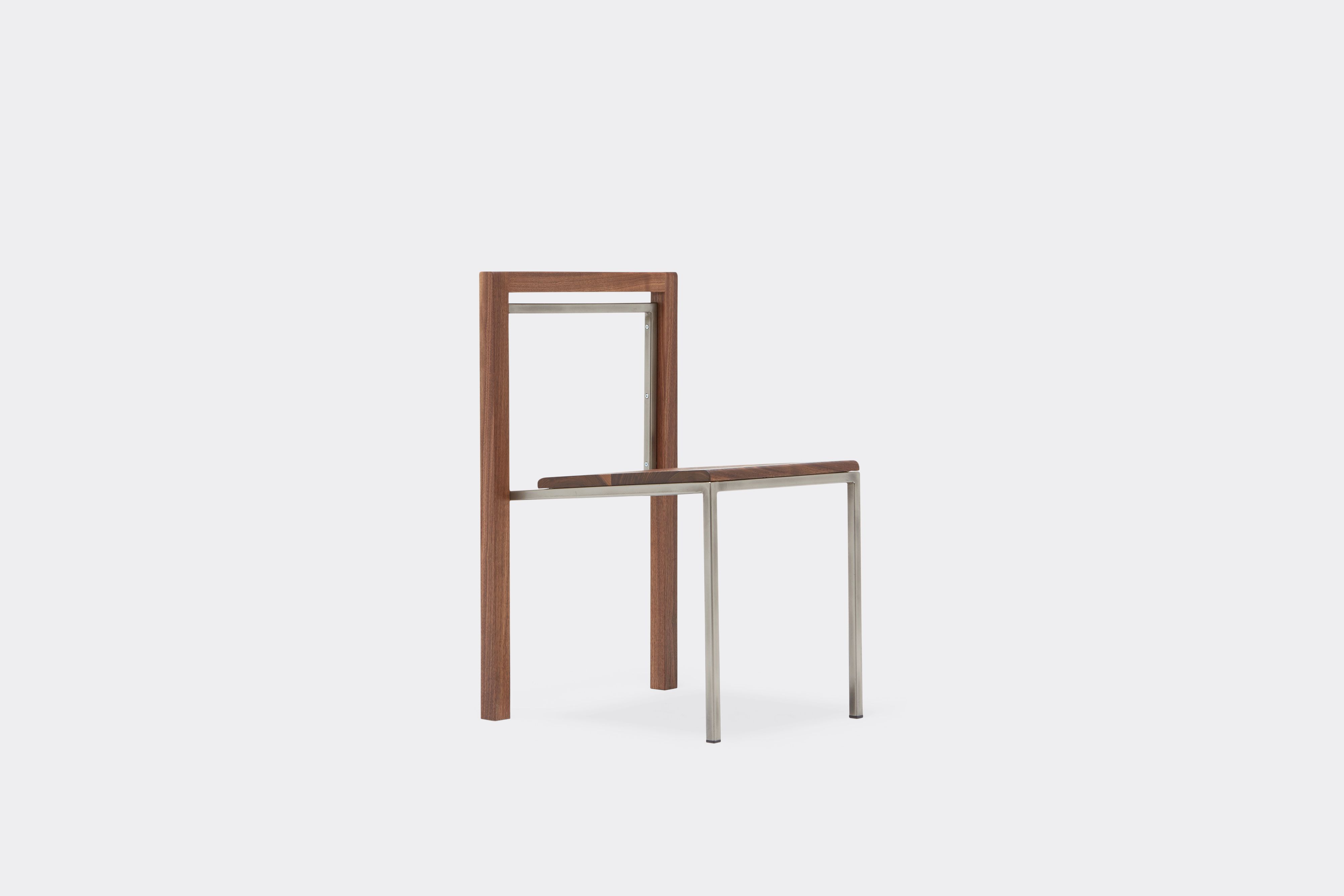 side view of walnut and antique nickel dining chair
