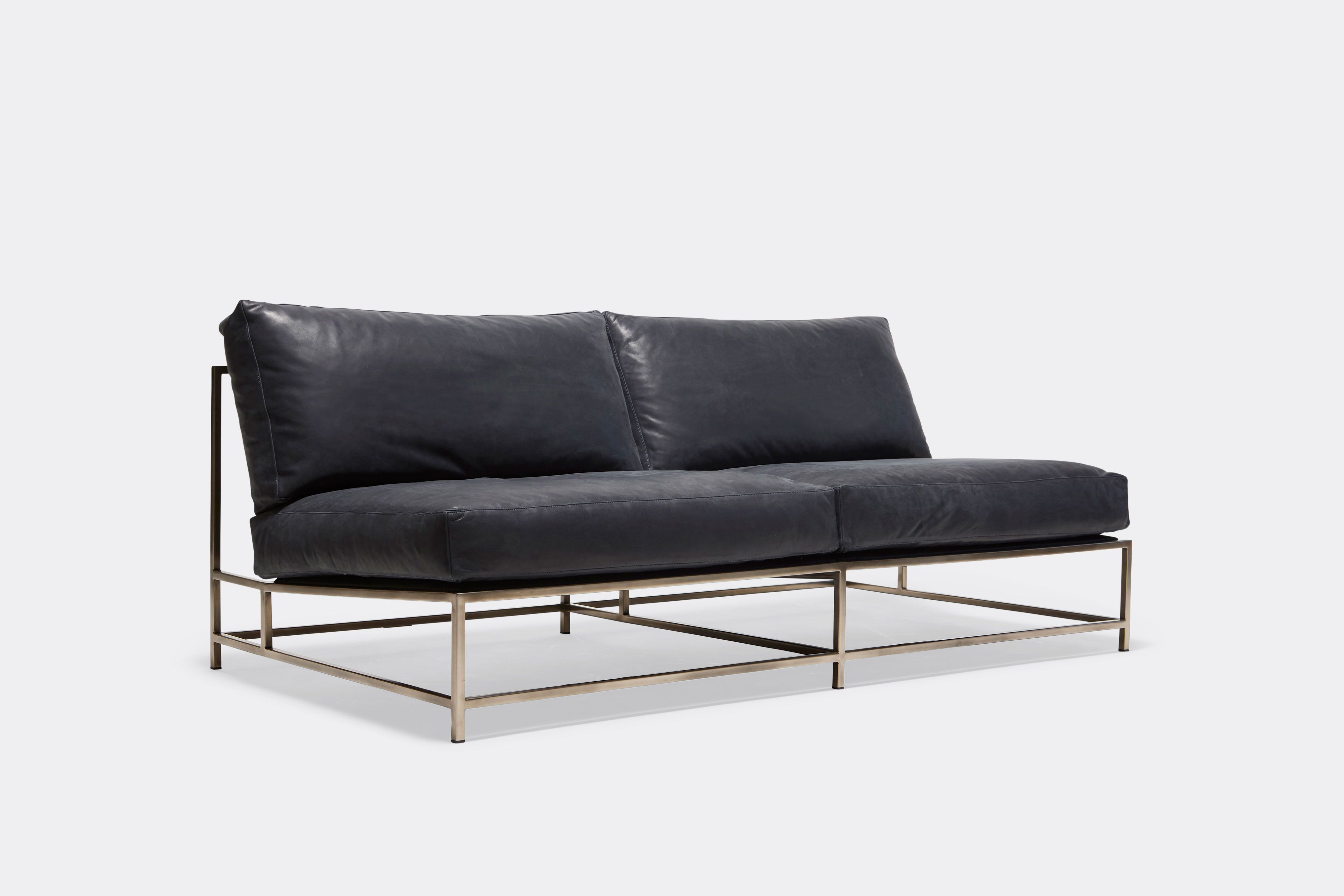 side of loveseat with blue leather upholstery on antique nickel metal frame
