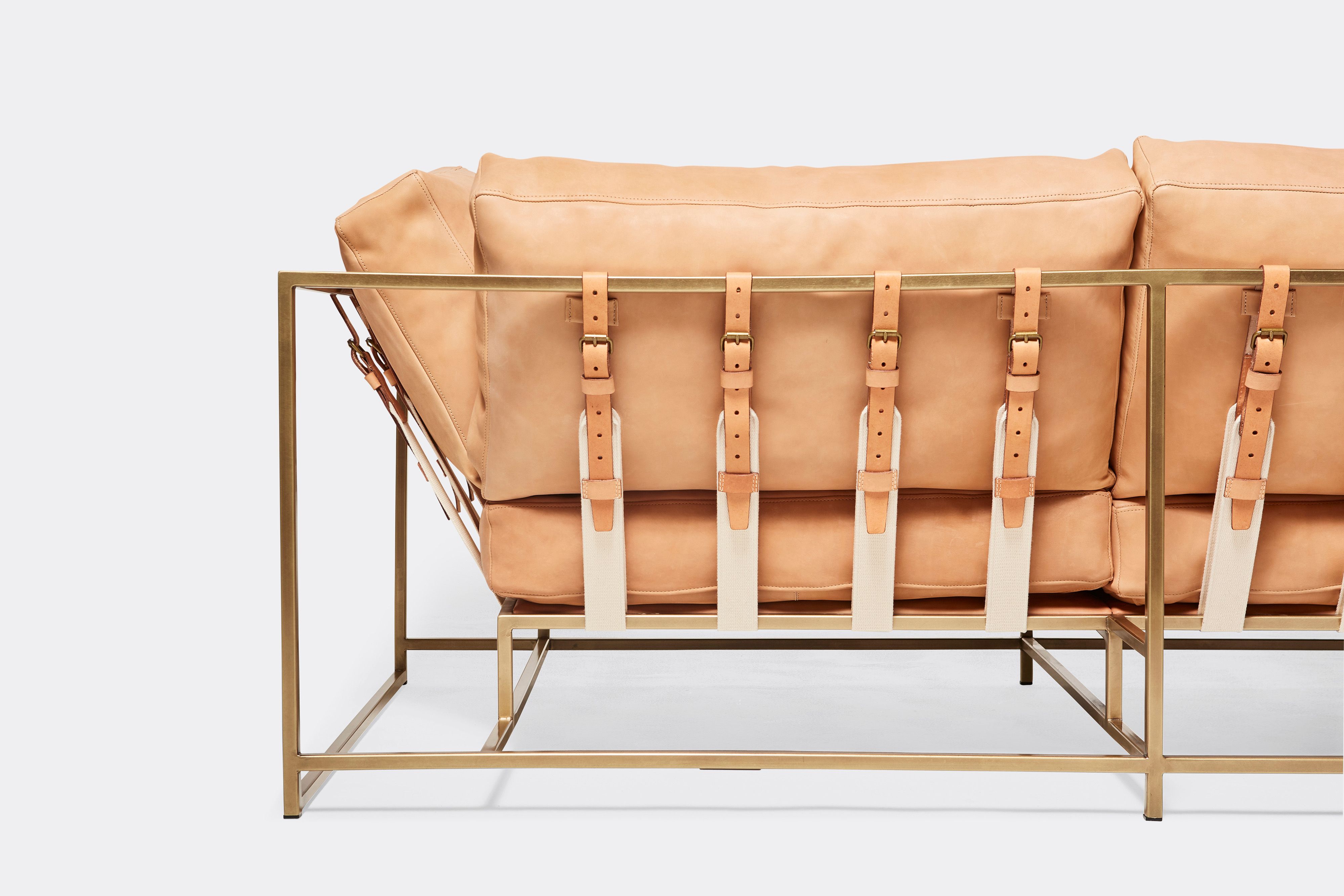 back of two seat sofa veg tan leather upholstery and veg tan leather belts on antique brass metal frame