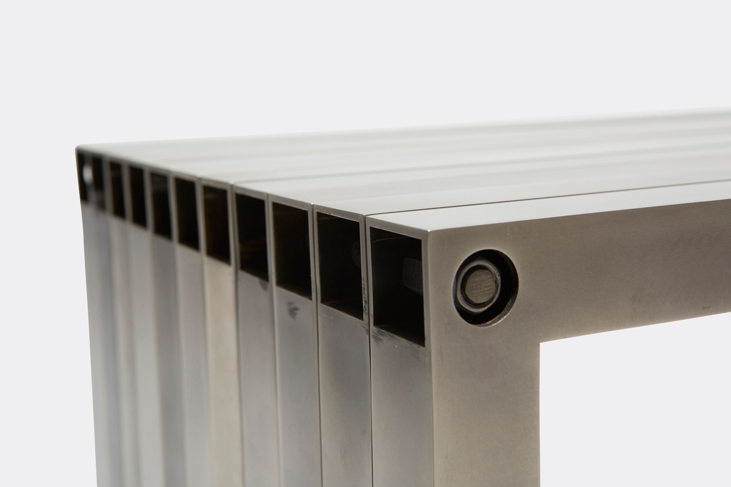 a steel bench shown on a white background .