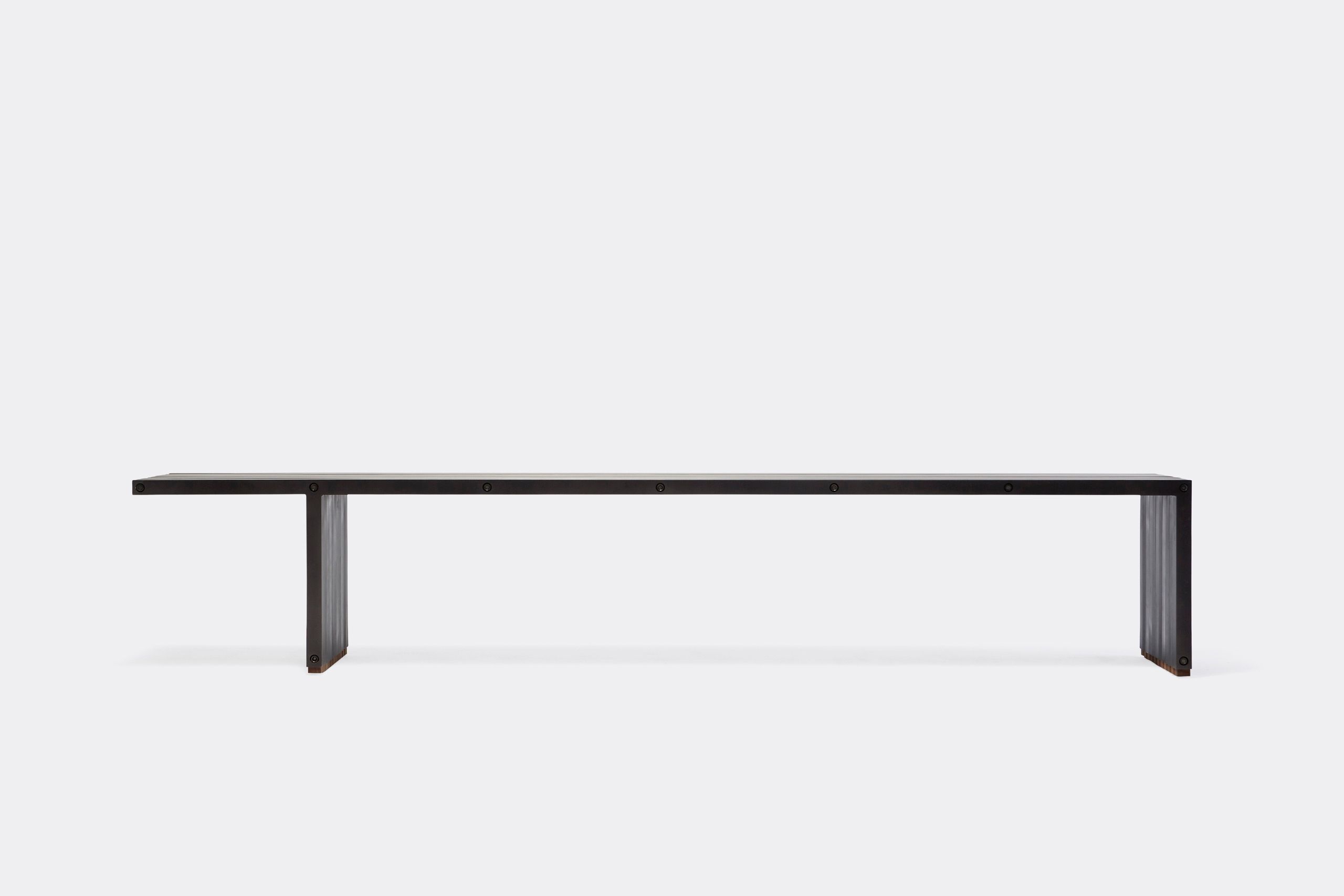 a black aluminum bench on a white background .