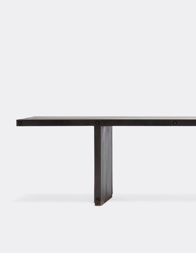 a black aluminum bench on a white background .