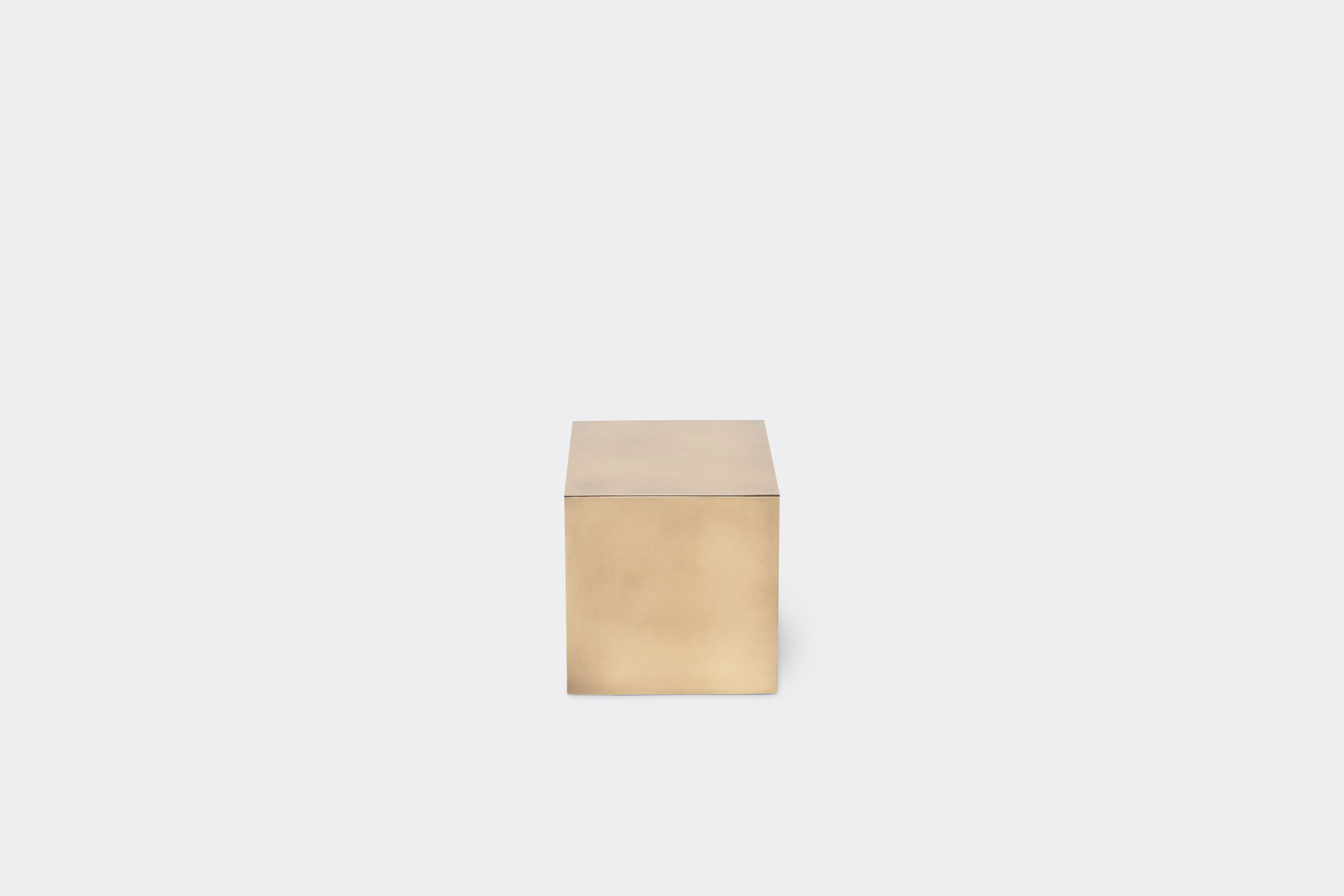 bottom of block table made with antique brass metal frame